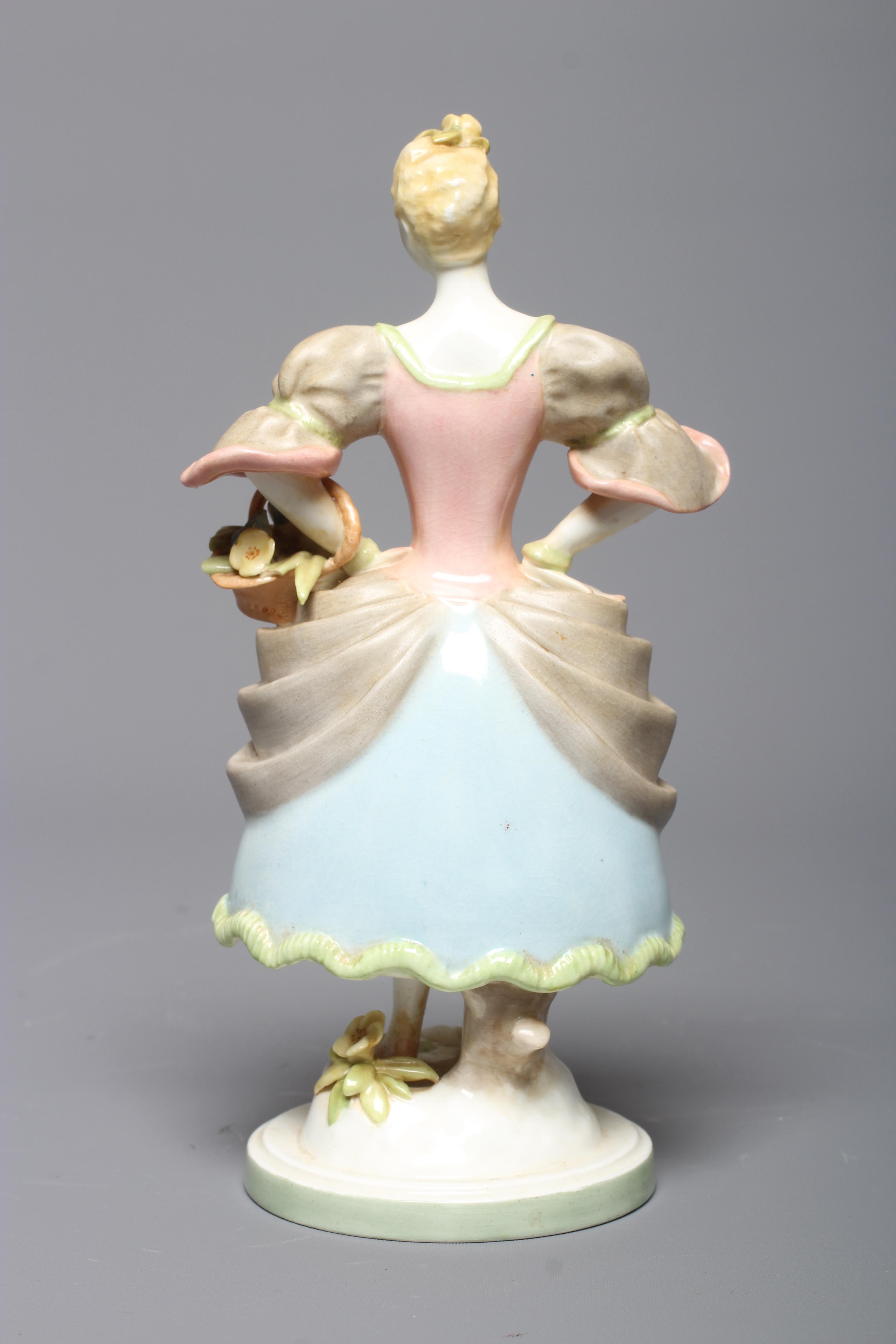 AGNES PINDER DAVIS FOR ROYAL WORCESTER - A Watteau figure of a young female flower seller Image