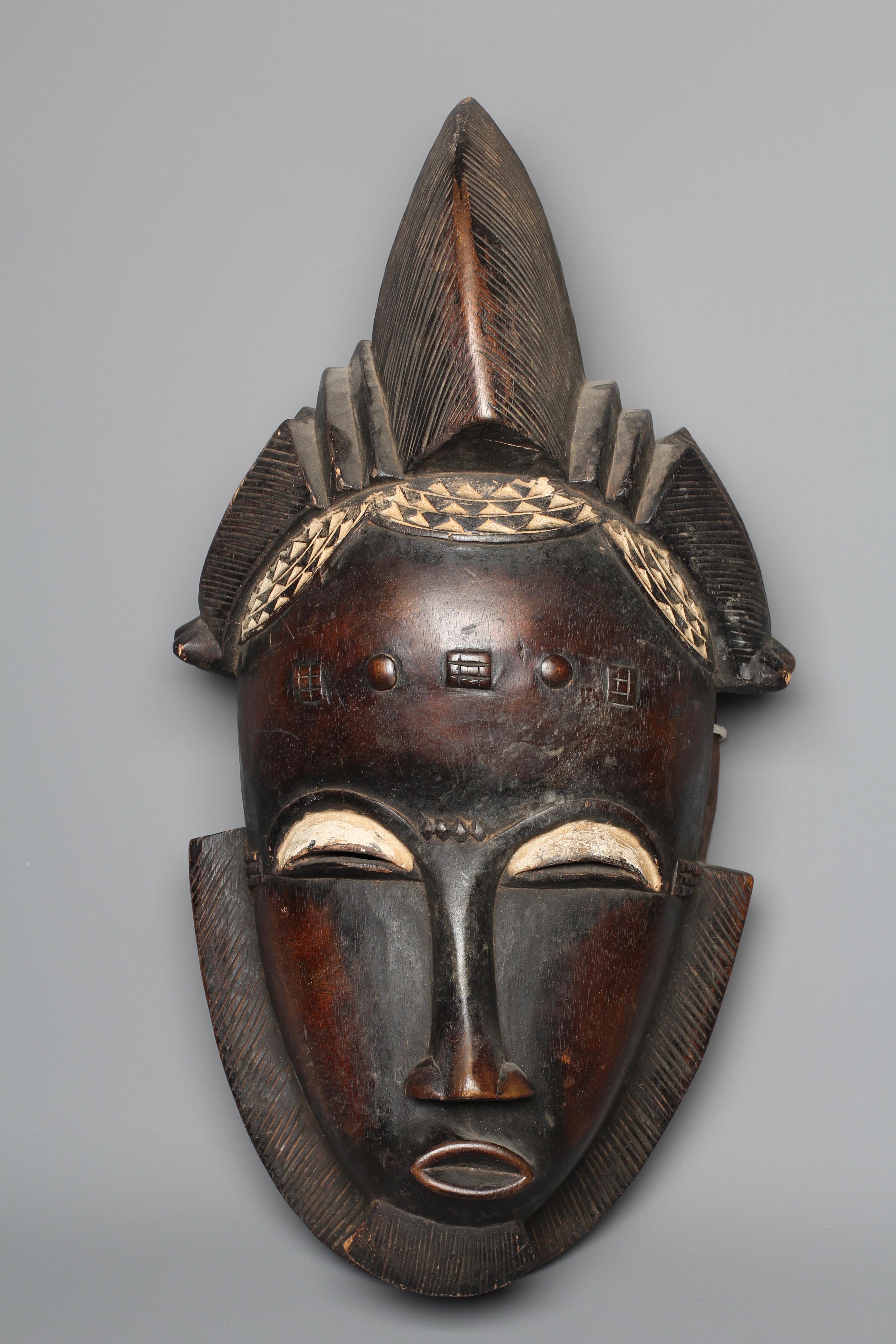 A BAULE MASK, Ivory Coast, with scarifications and a short beard, 20" high Image
