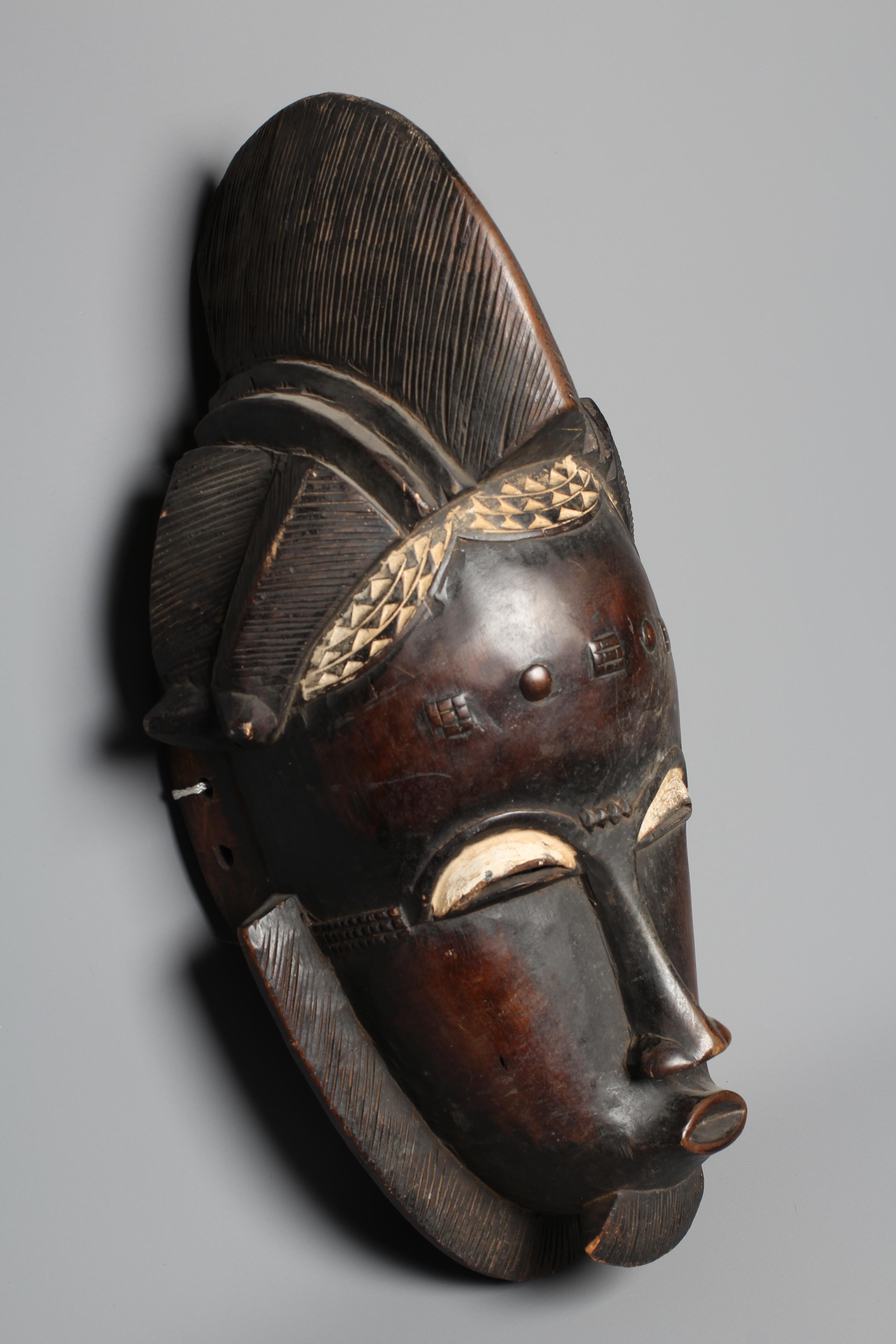 A BAULE MASK, Ivory Coast, with scarifications and a short beard, 20" high Image