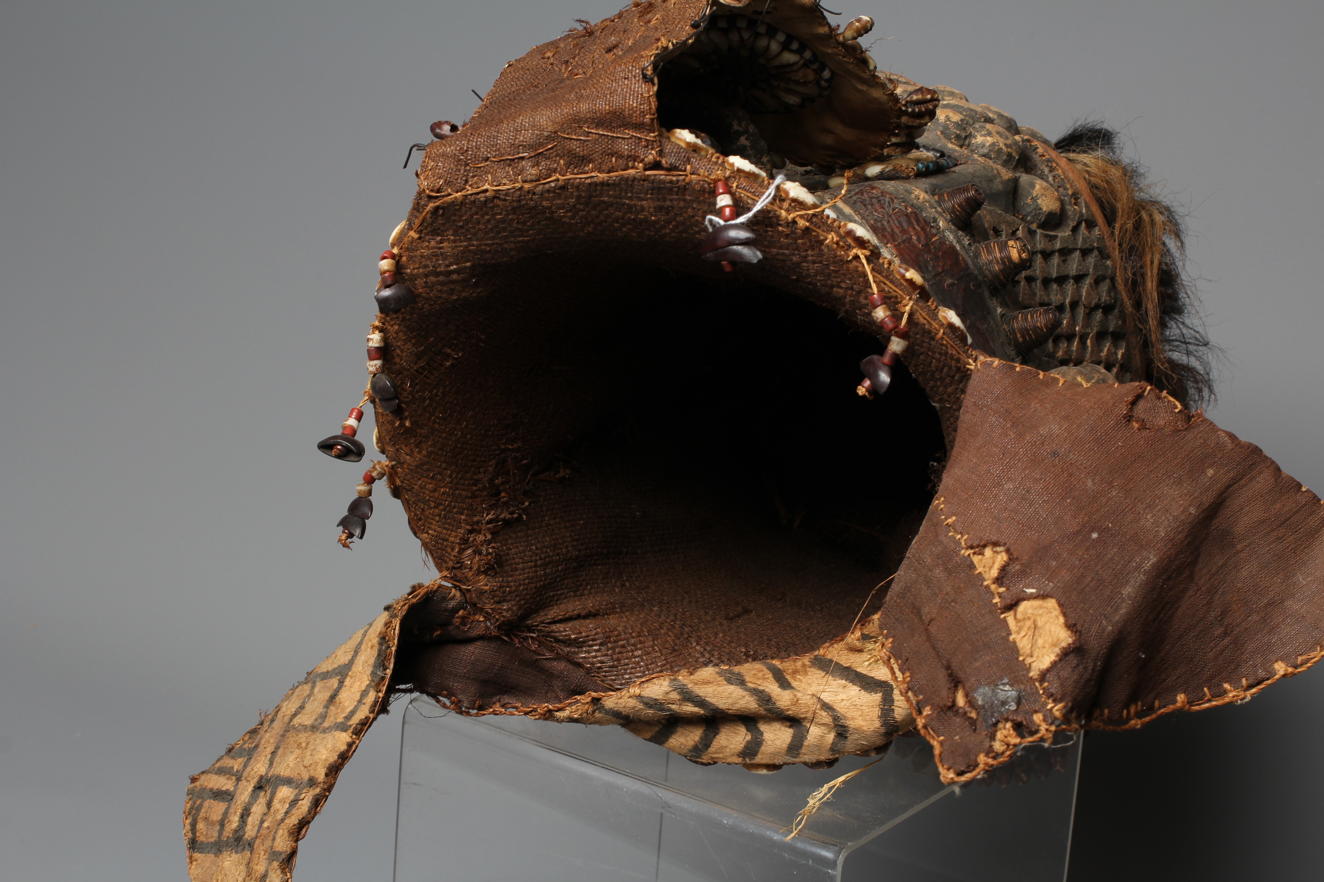 A KUBA BWOOM MASK, Congo, wood, hide, cloth and hair, with shell and bead decoration, 12" high Image