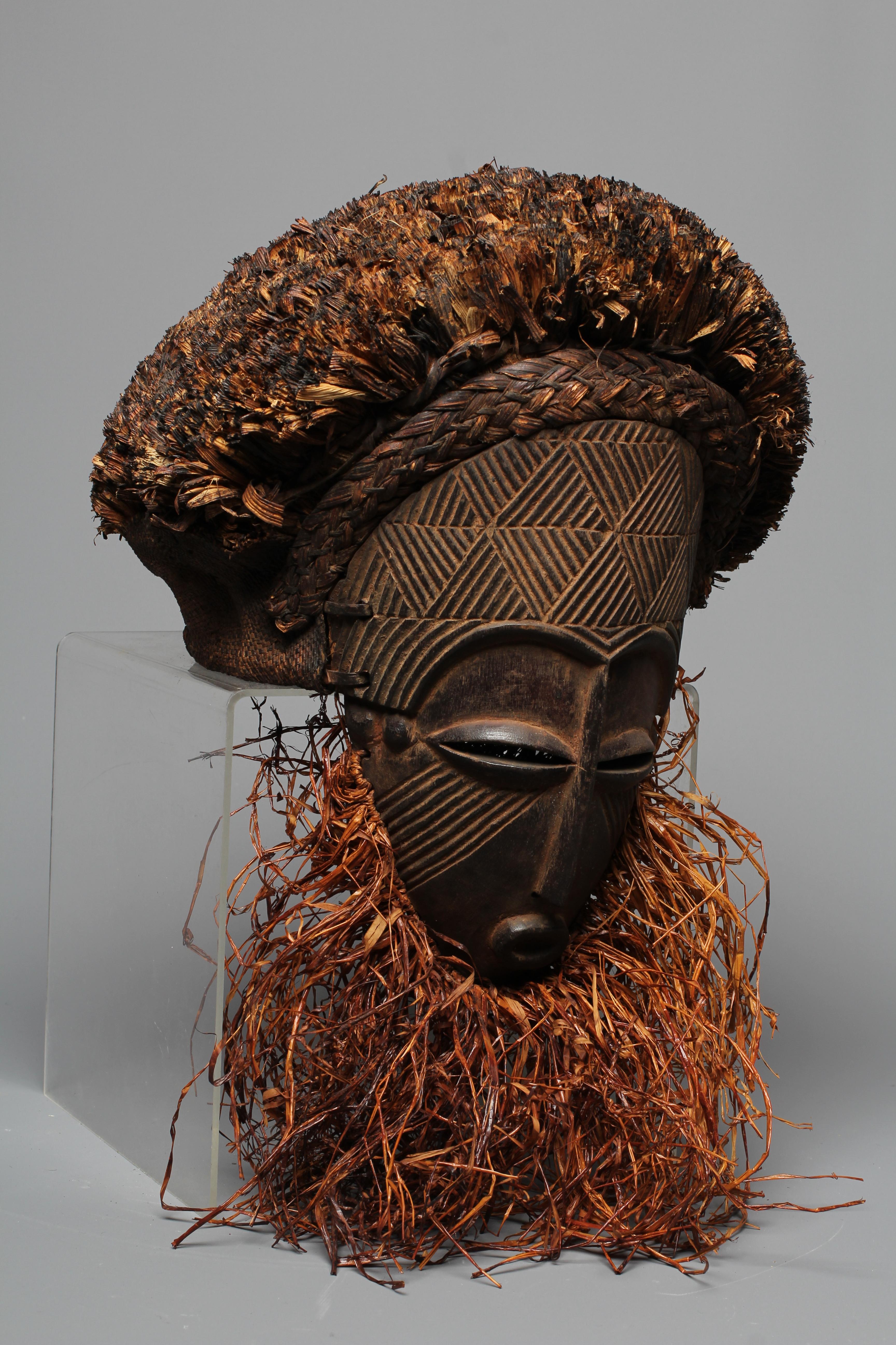 A CHOKWE OVAL MASK, Angola/Congo, with fibre hair and beard and geometric decoration in relief to Image