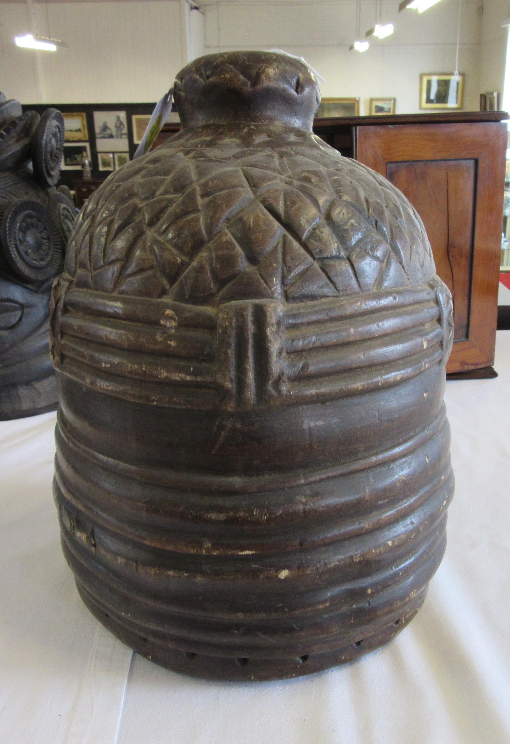 A MENDE HELMET MASK, Sierra Leone, heavily carved wood, 13 1/2", together with another Mende helmet Image