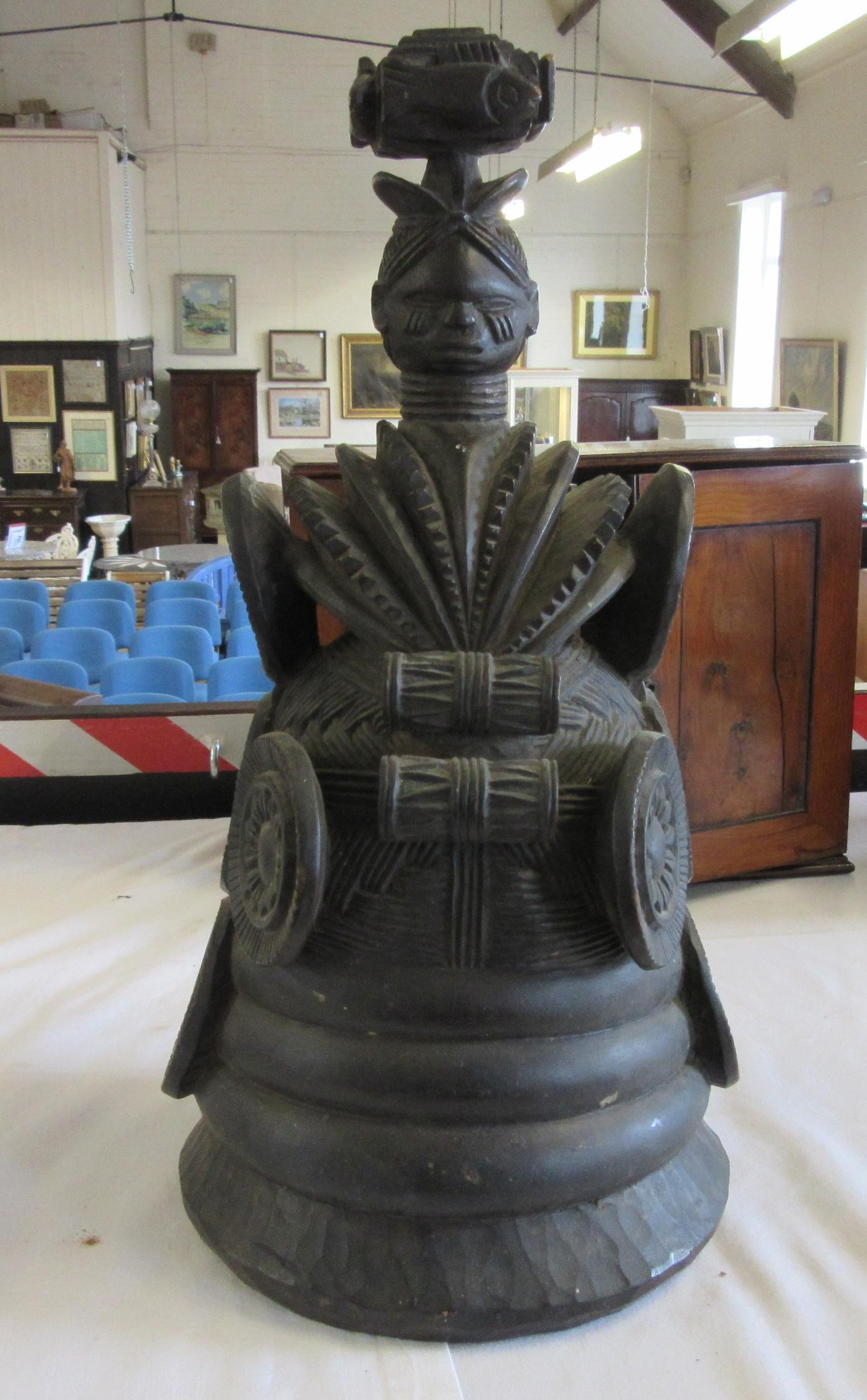 A MENDE HELMET MASK, Sierra Leone, heavily carved wood, 13 1/2", together with another Mende helmet Image