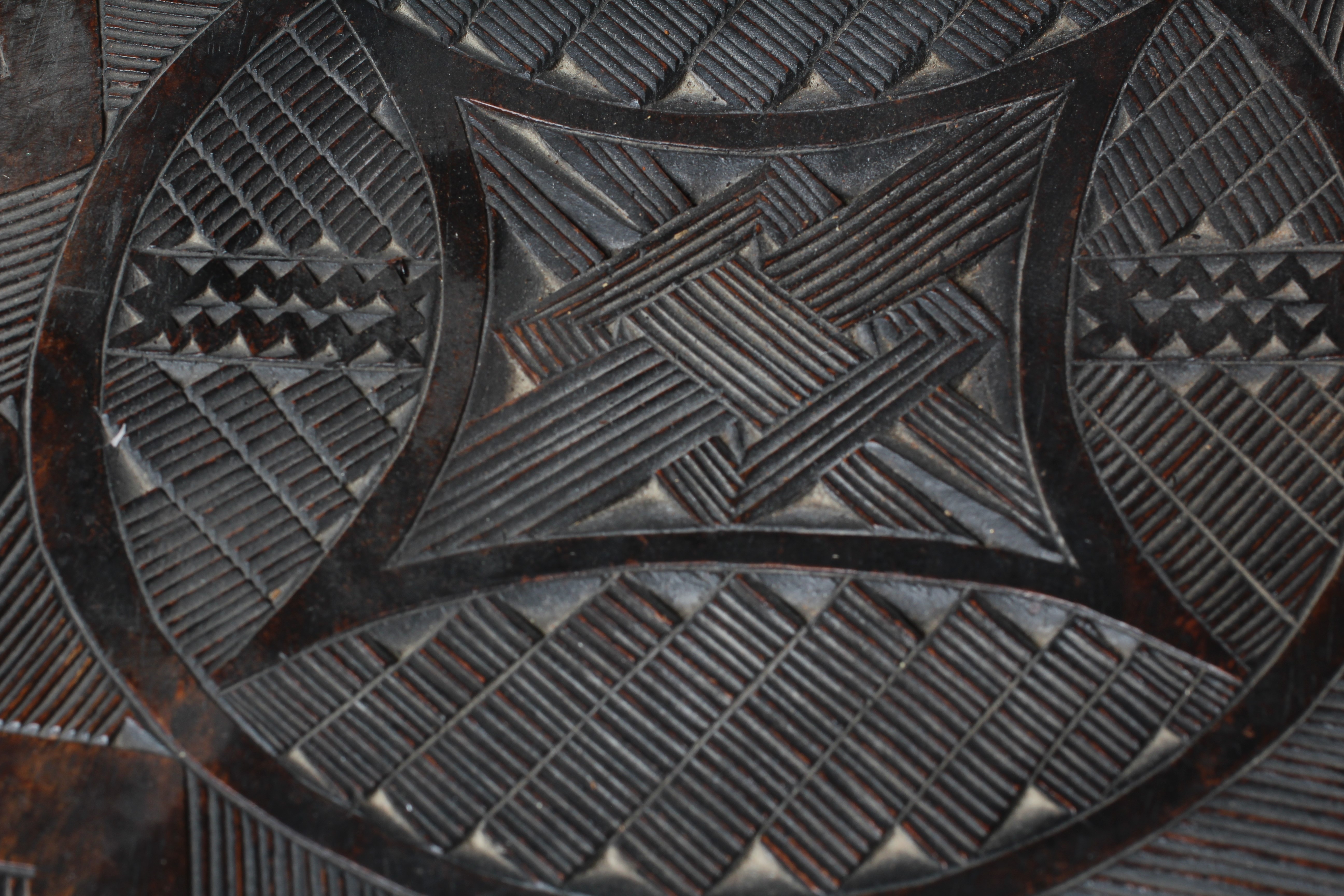 A NUPE TRIBAL STOOL, the circular top decorated with a geometric design raised on ten circular Image
