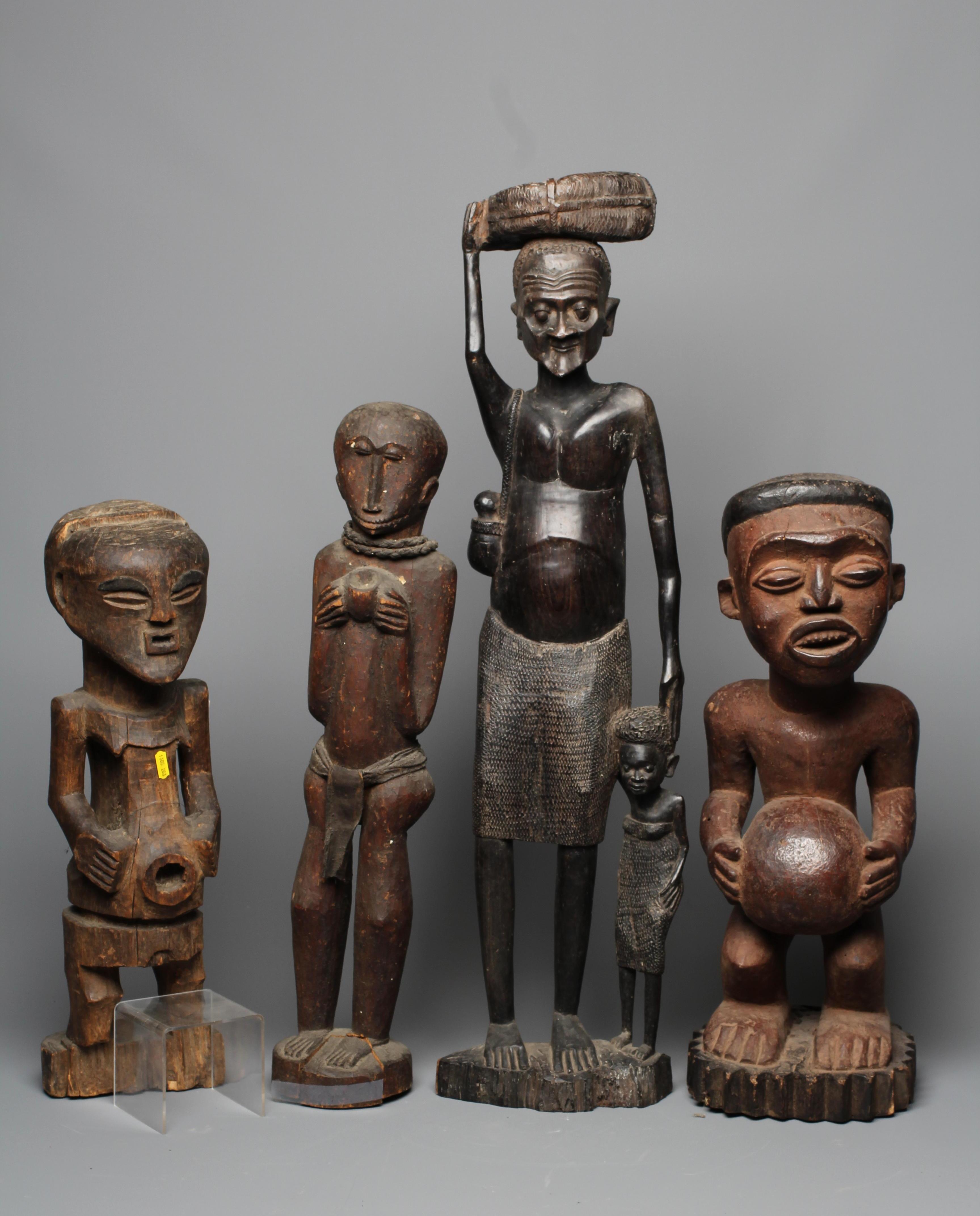 FOUR AFRICAN CARVED WOOD SCULPTURES Image