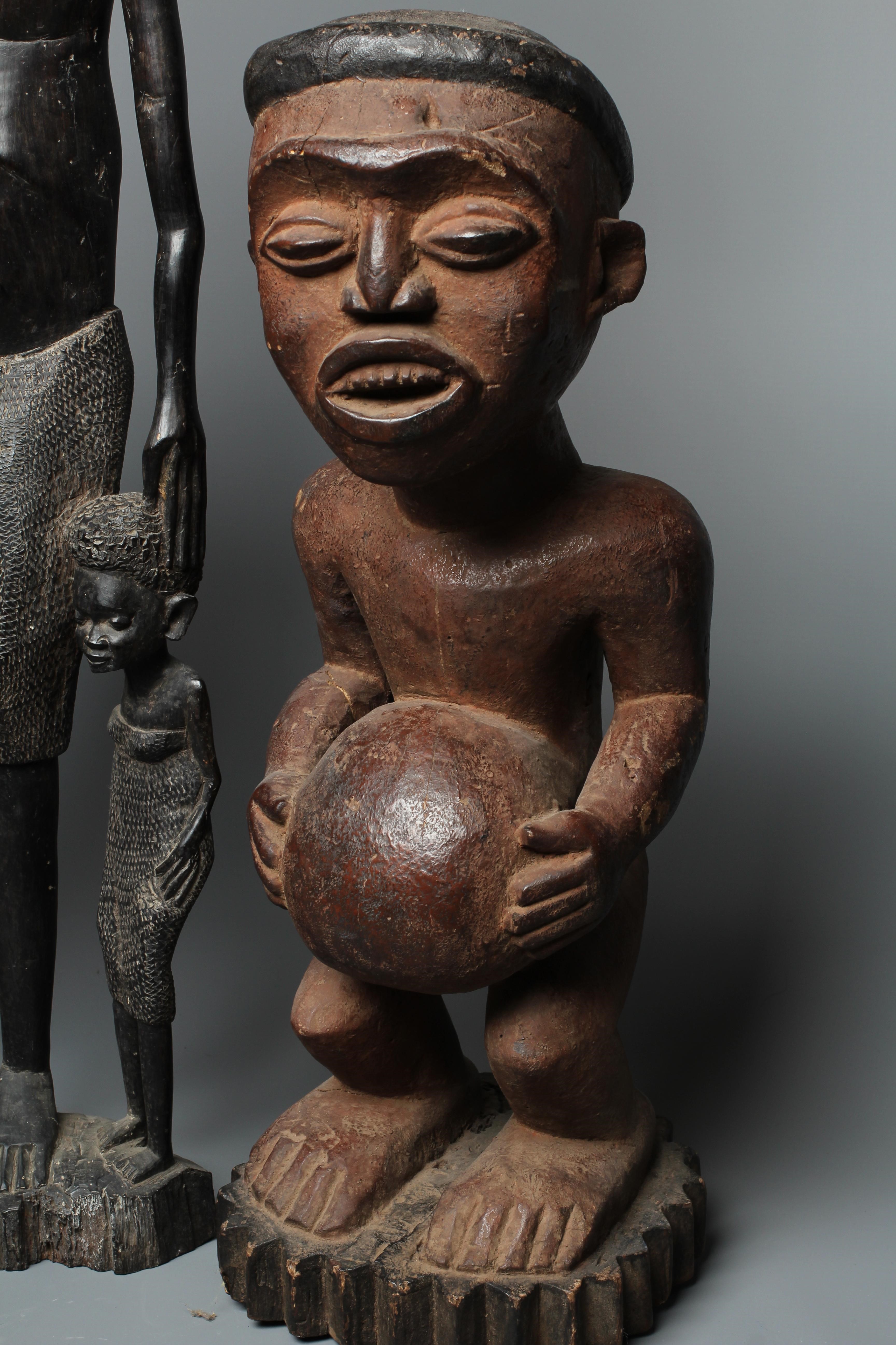 FOUR AFRICAN CARVED WOOD SCULPTURES Image