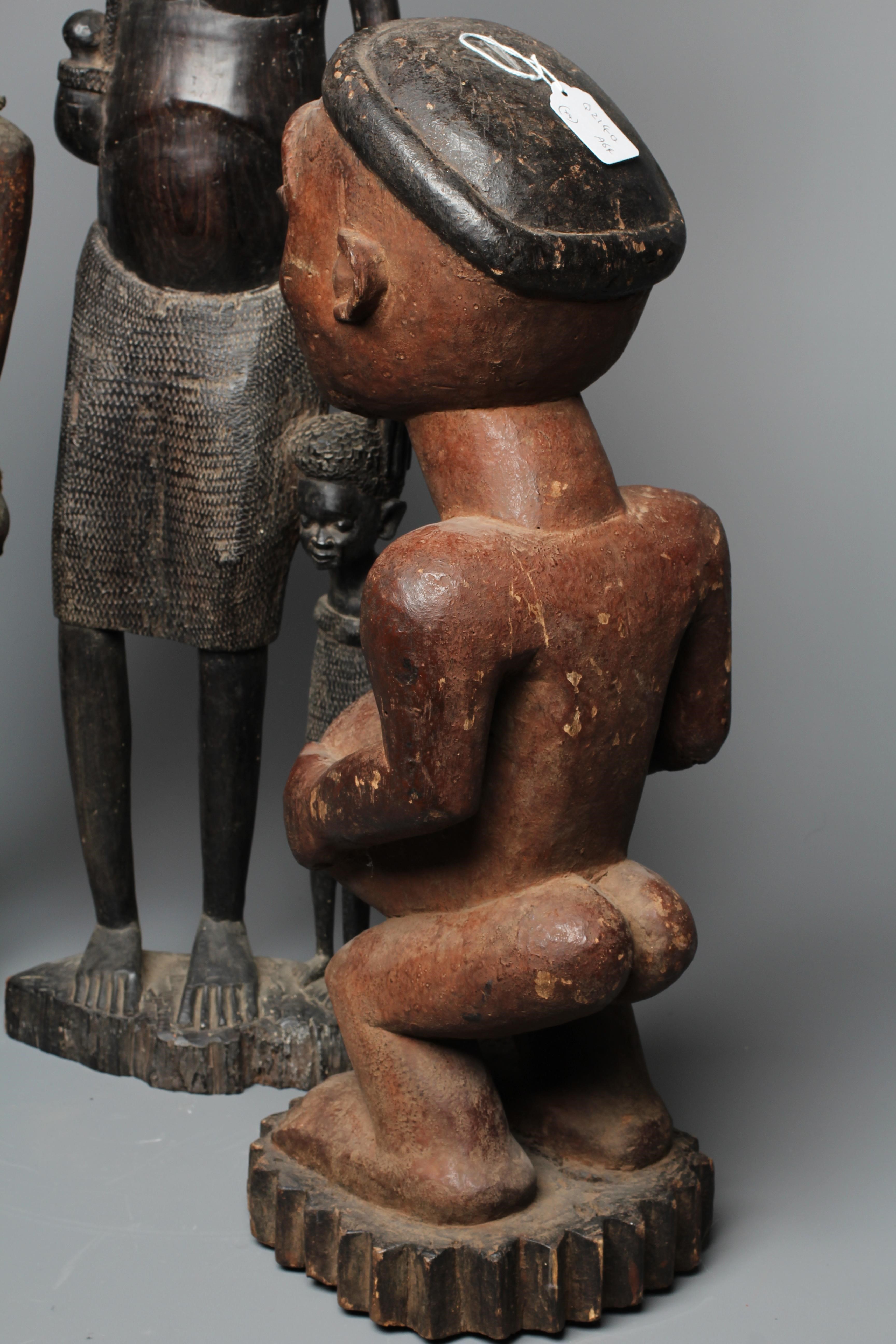 FOUR AFRICAN CARVED WOOD SCULPTURES Image