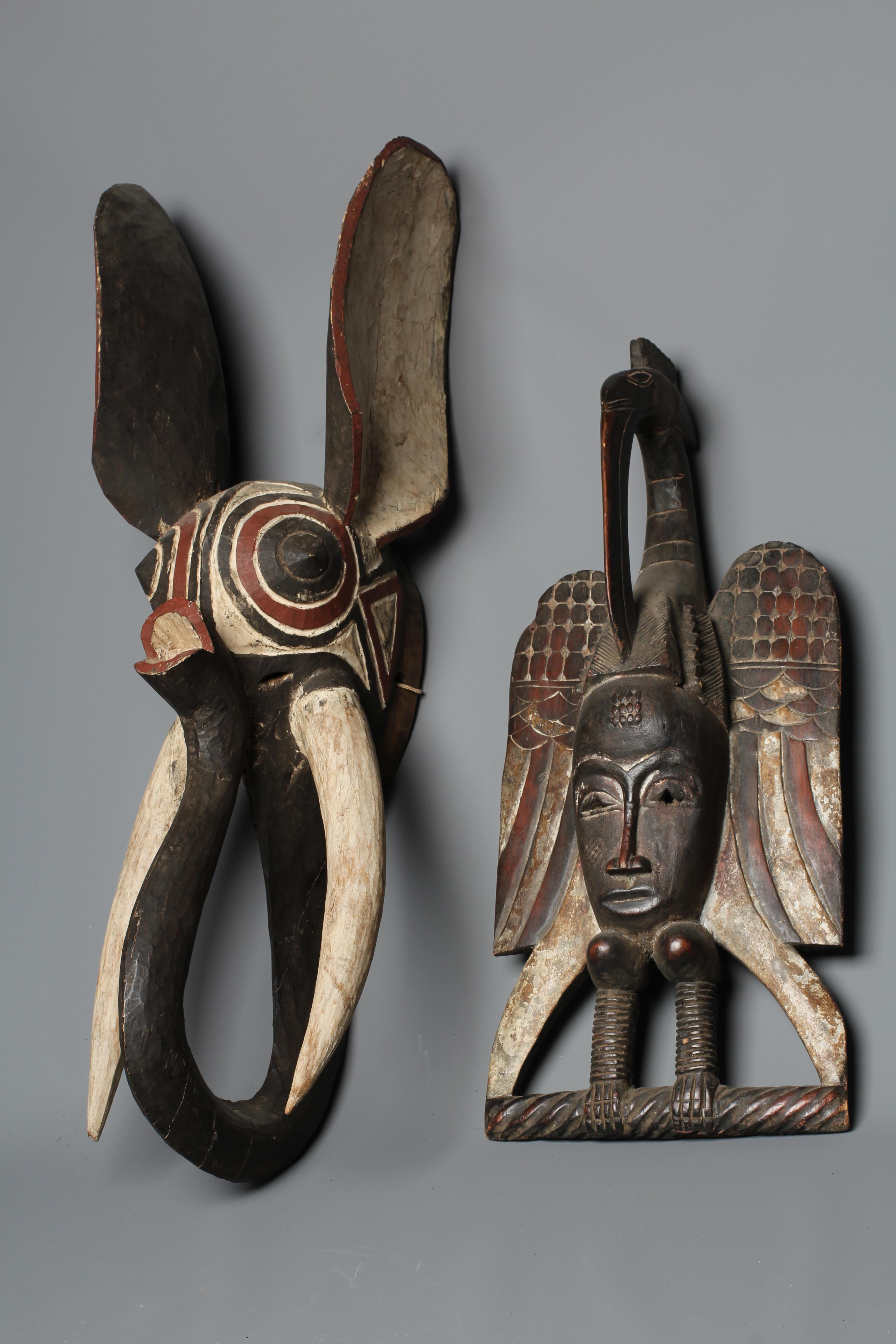 A CENTRAL AFRICAN CARVED WOOD ELEPHANT MASK, hand painted with shaped curved trunk, alert ears and Image