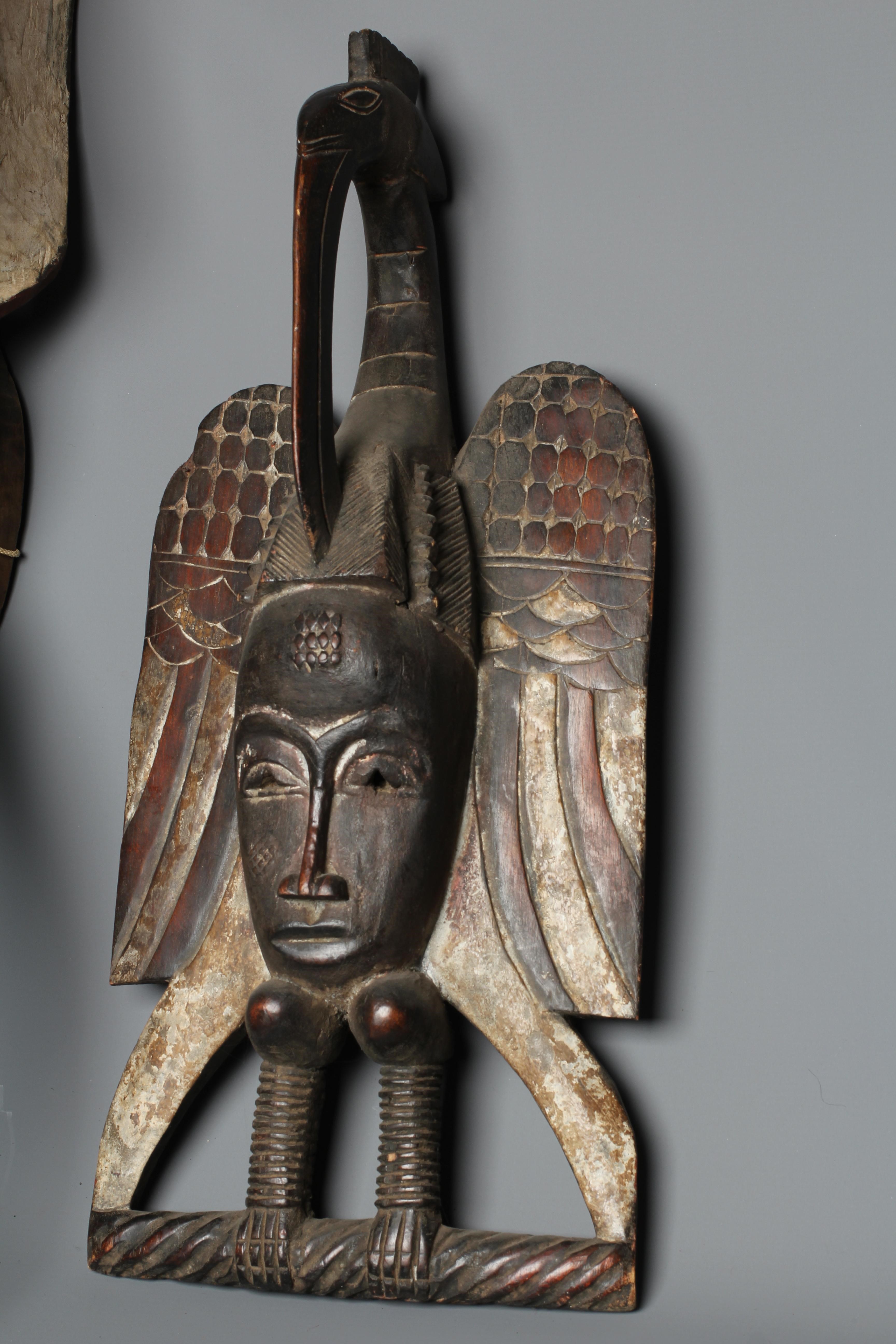 A CENTRAL AFRICAN CARVED WOOD ELEPHANT MASK, hand painted with shaped curved trunk, alert ears and Image