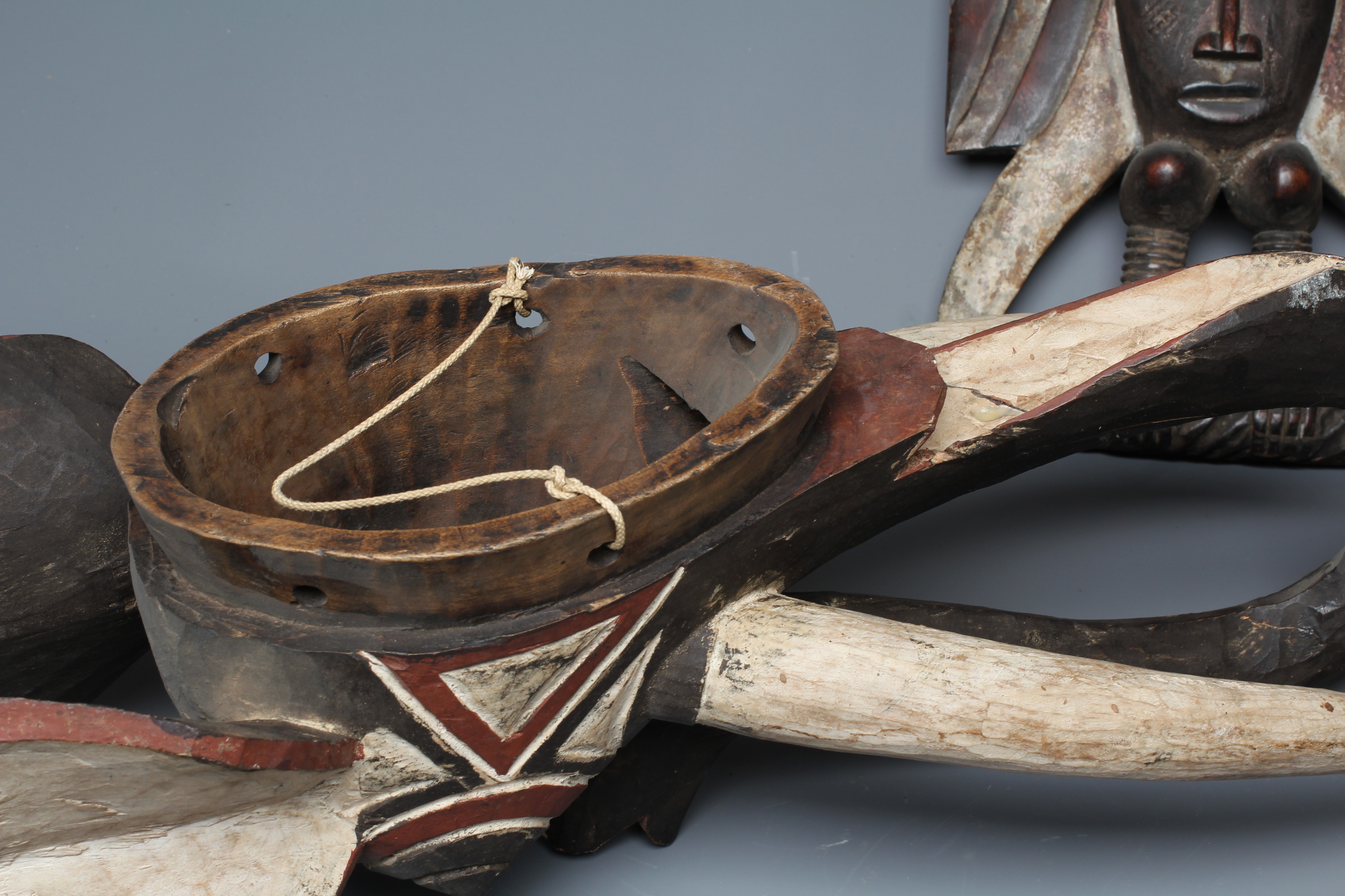 A CENTRAL AFRICAN CARVED WOOD ELEPHANT MASK, hand painted with shaped curved trunk, alert ears and Image