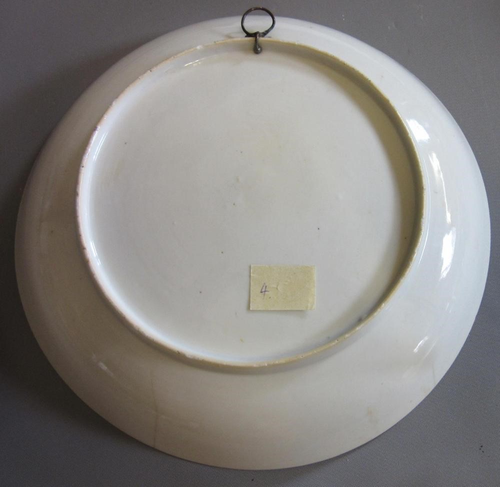 FOUR CHINESE FAMILLE ROSE PORCELAIN PLATES comprising a saucer dish with figures and dogs on a Image