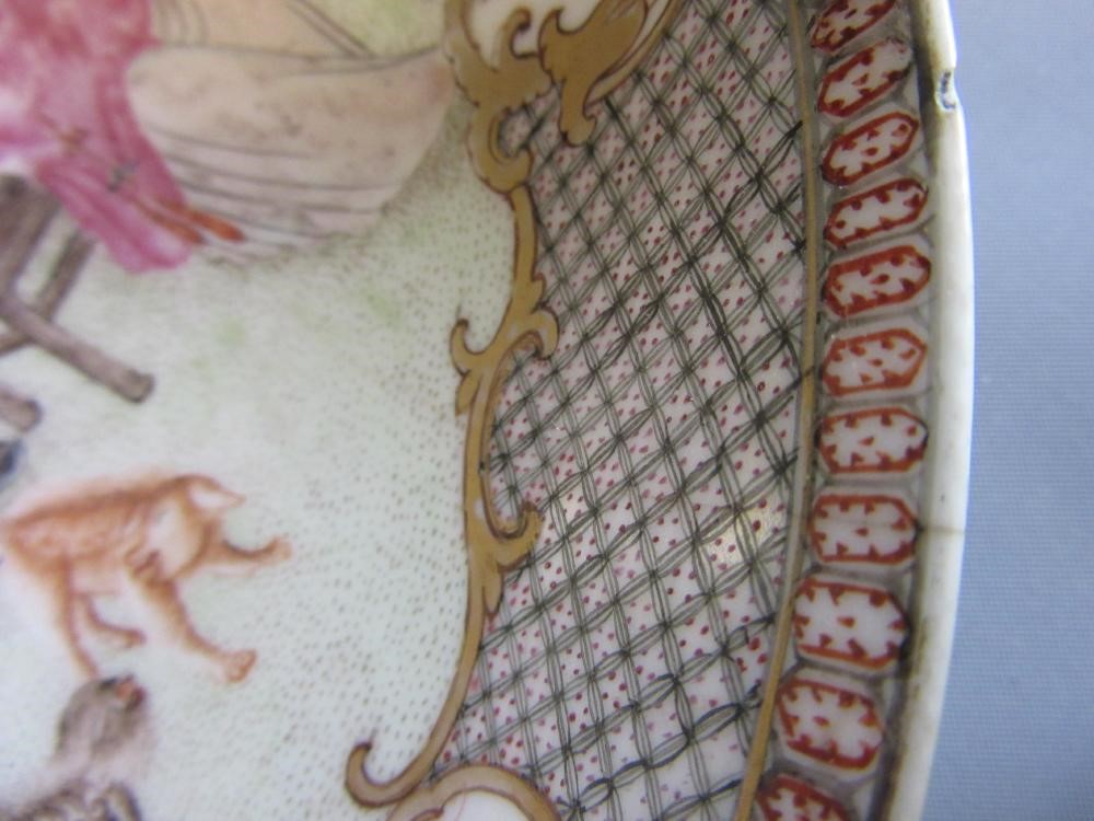FOUR CHINESE FAMILLE ROSE PORCELAIN PLATES comprising a saucer dish with figures and dogs on a Image