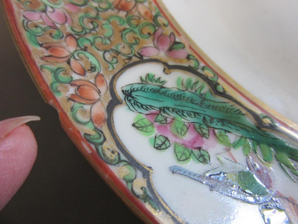 FOUR CHINESE FAMILLE ROSE PORCELAIN PLATES comprising a saucer dish with figures and dogs on a Image