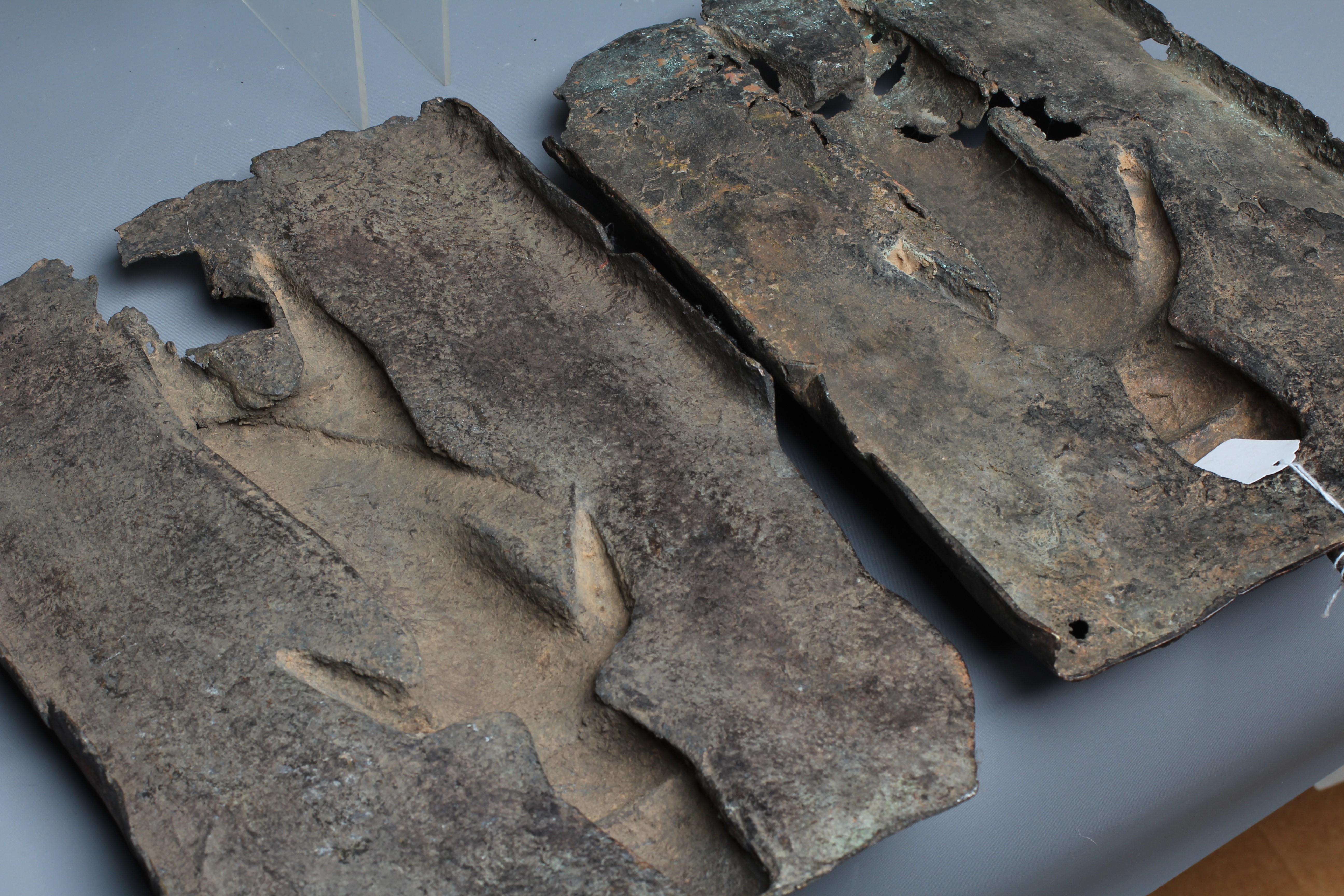 A PAIR OF BENIN BRONZE PLAQUES, each worked in relief with central warrior figure, 15 1/2" x 9 1/2" Image