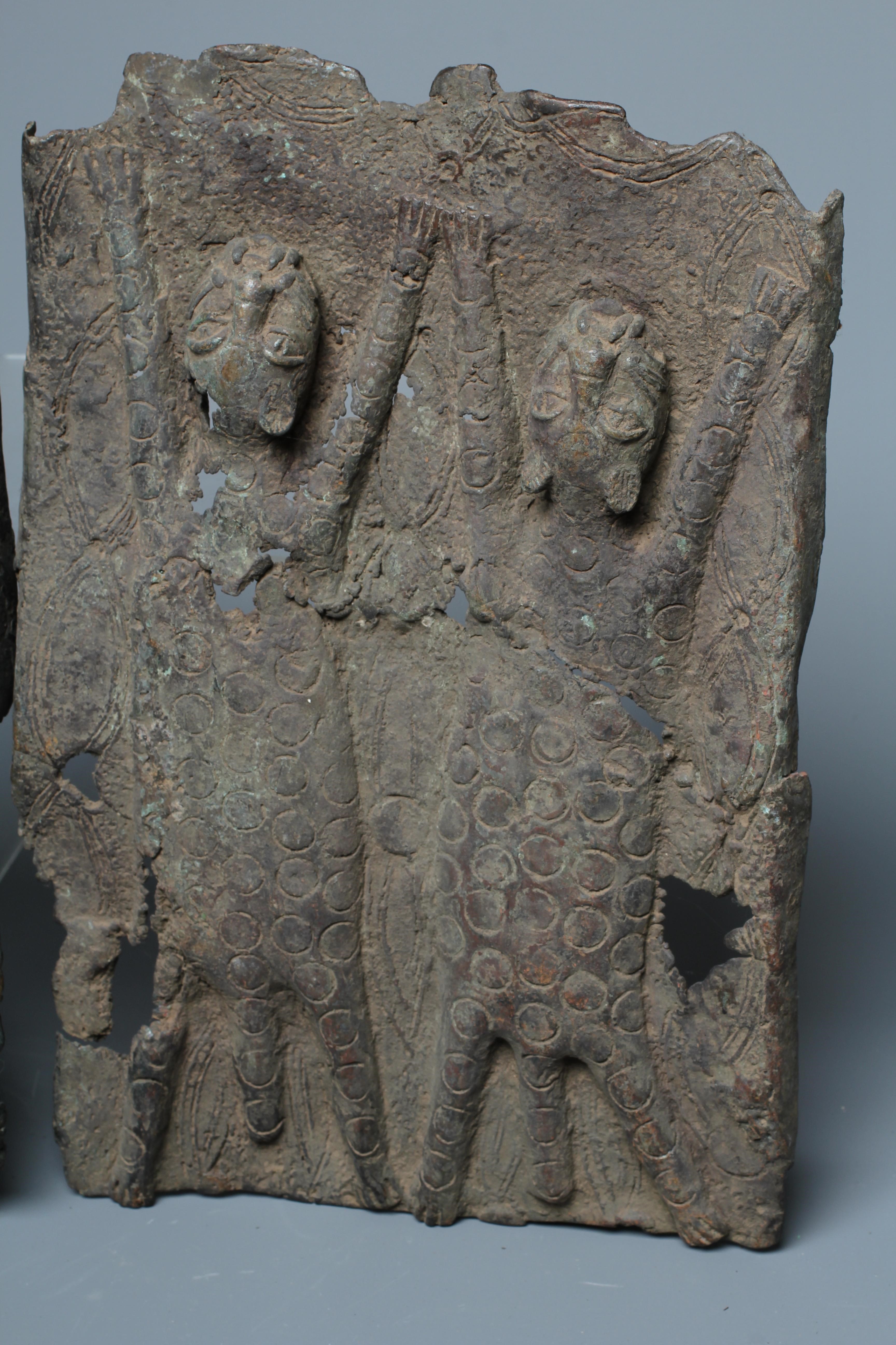 A BENIN BRONZE PLAQUE worked in relief with two leopards, 14 1/2" h x 10" w, together with another Image