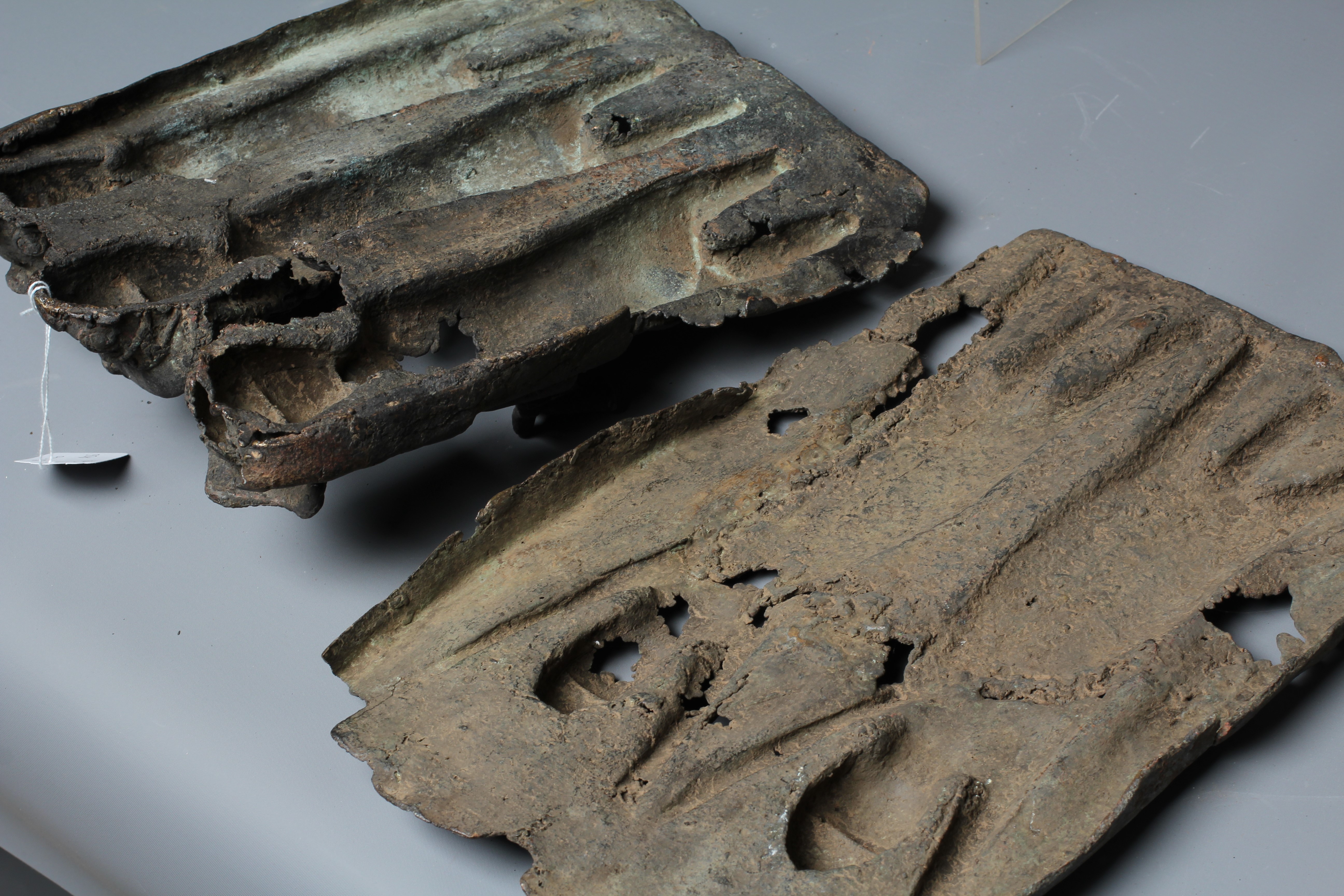 A BENIN BRONZE PLAQUE worked in relief with two leopards, 14 1/2" h x 10" w, together with another Image