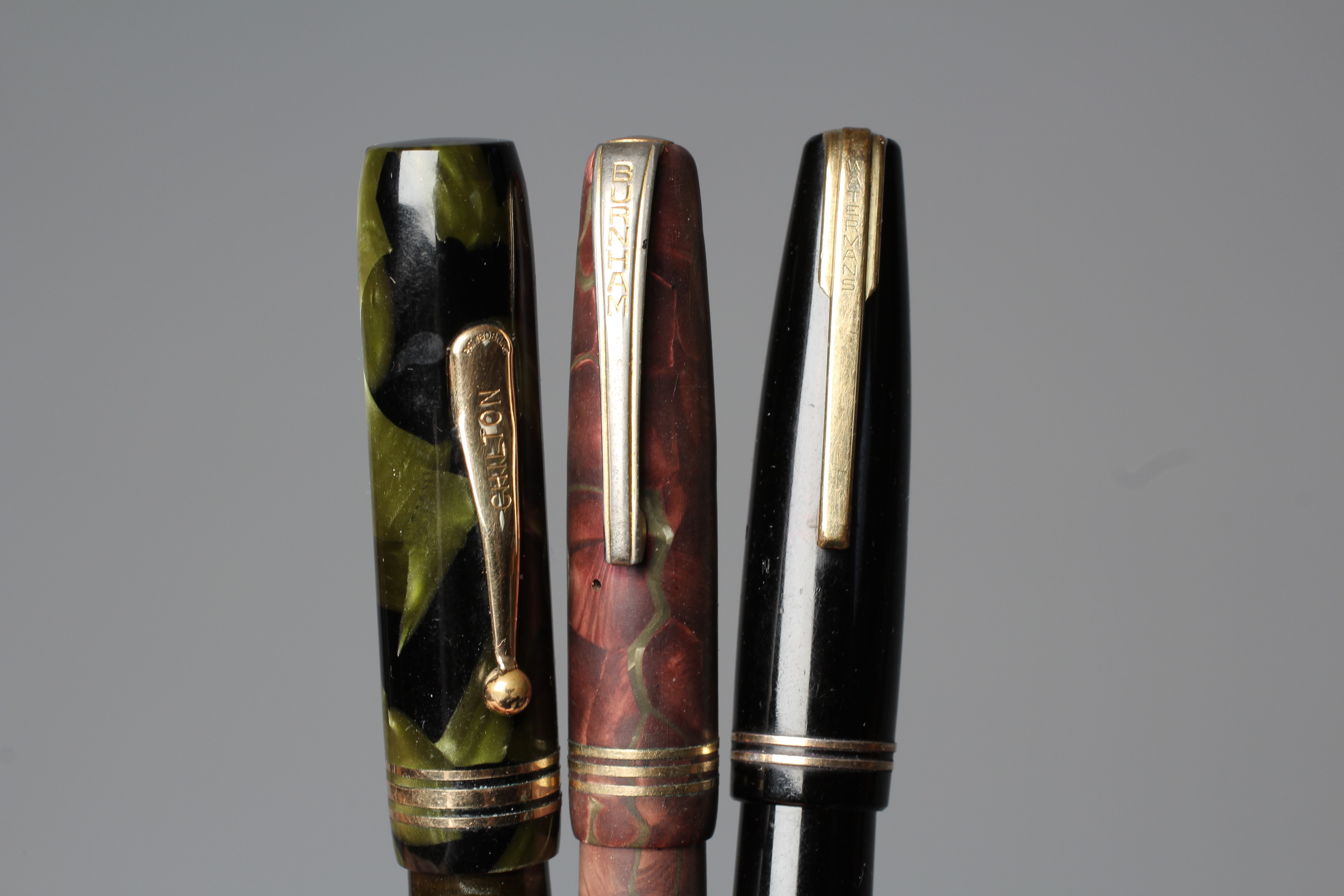 FIVE FOUNTAIN PENS: comprising a black Waterman's Ideal Commando lever filler pen marked 14kt Image