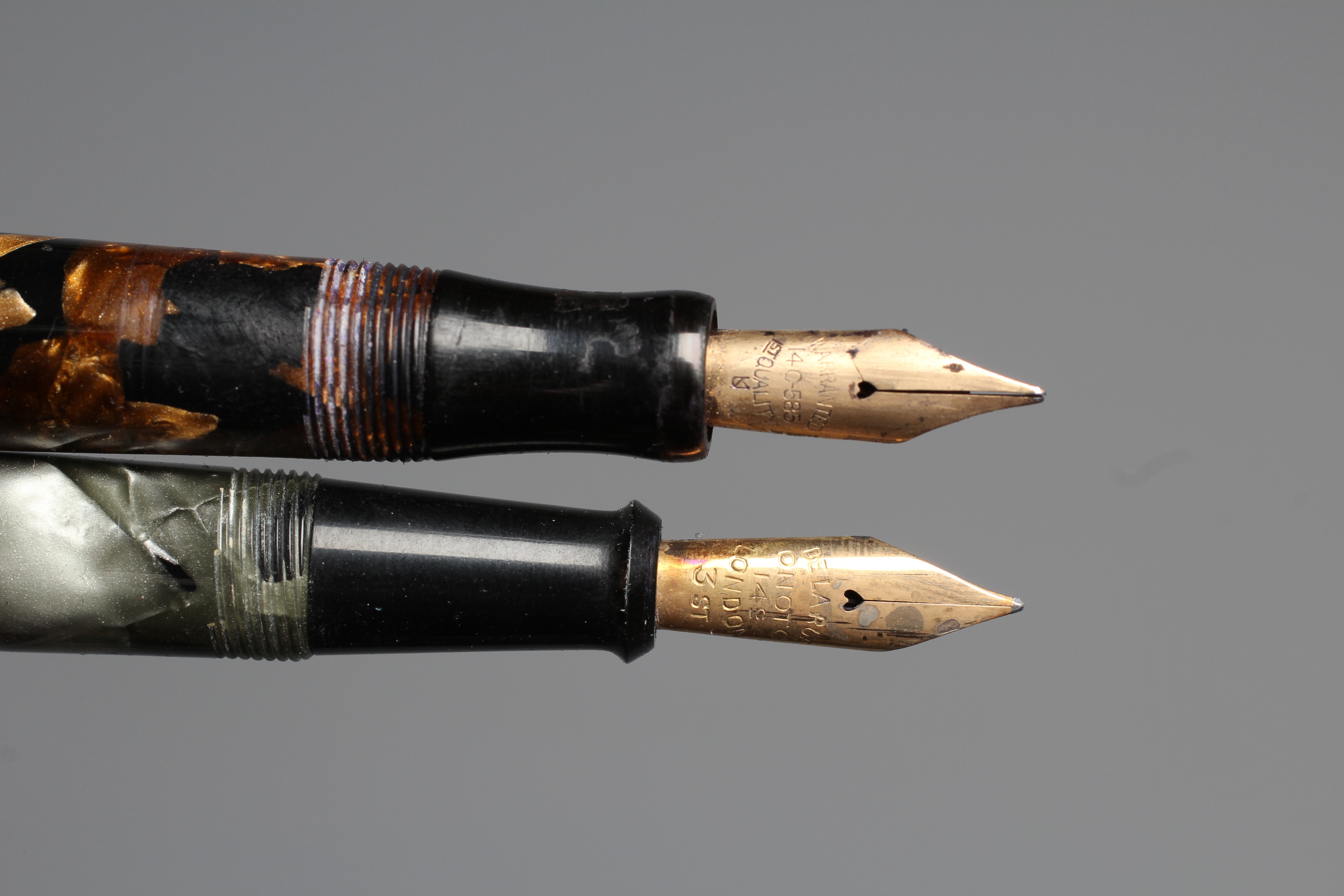 FIVE FOUNTAIN PENS: comprising a black Waterman's Ideal Commando lever filler pen marked 14kt Image