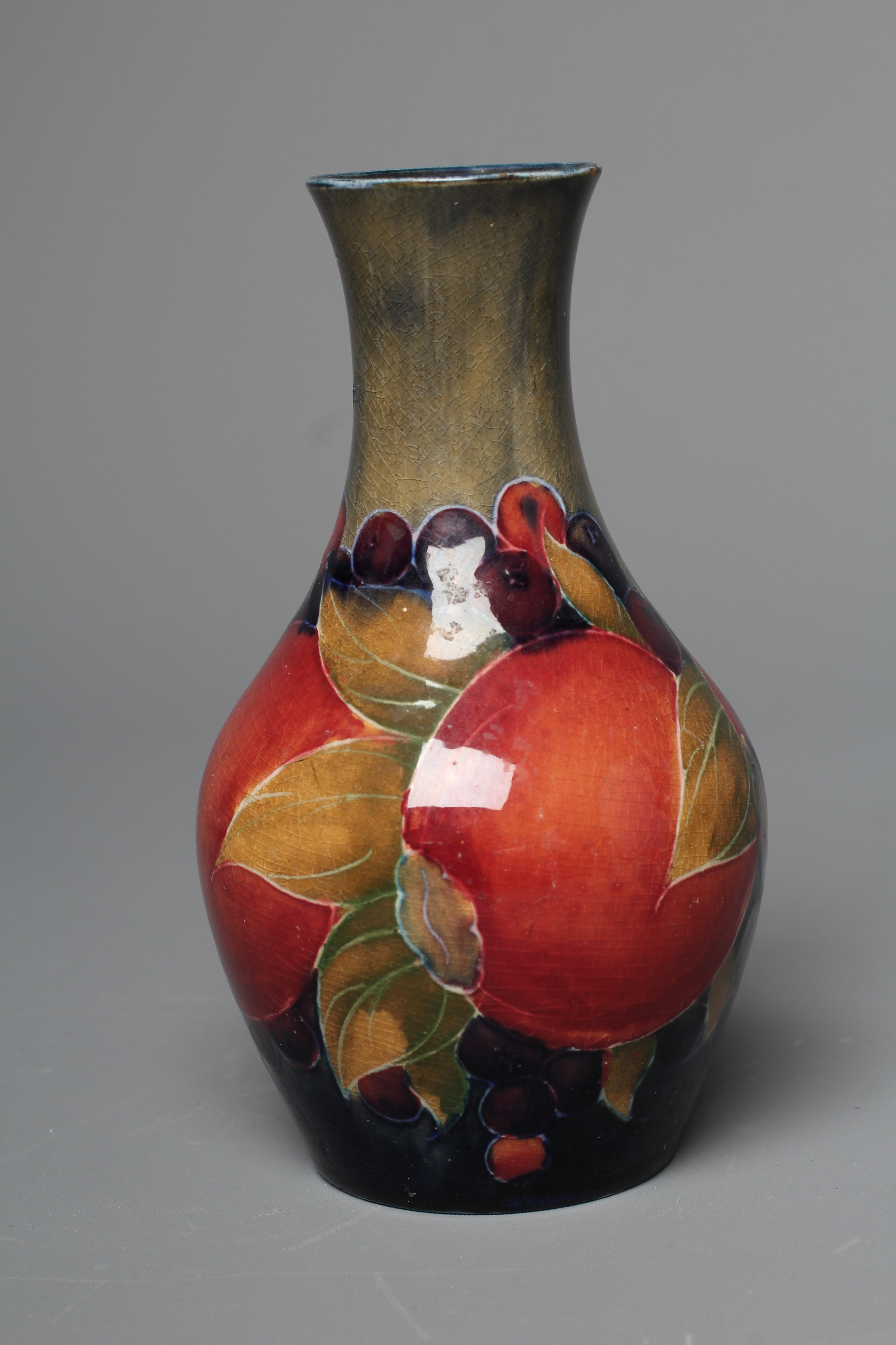 A MOORCROFT POMEGRANATE VASE, early 20th century, of baluster form, impressed Burslem mark, 5 1/2" Image