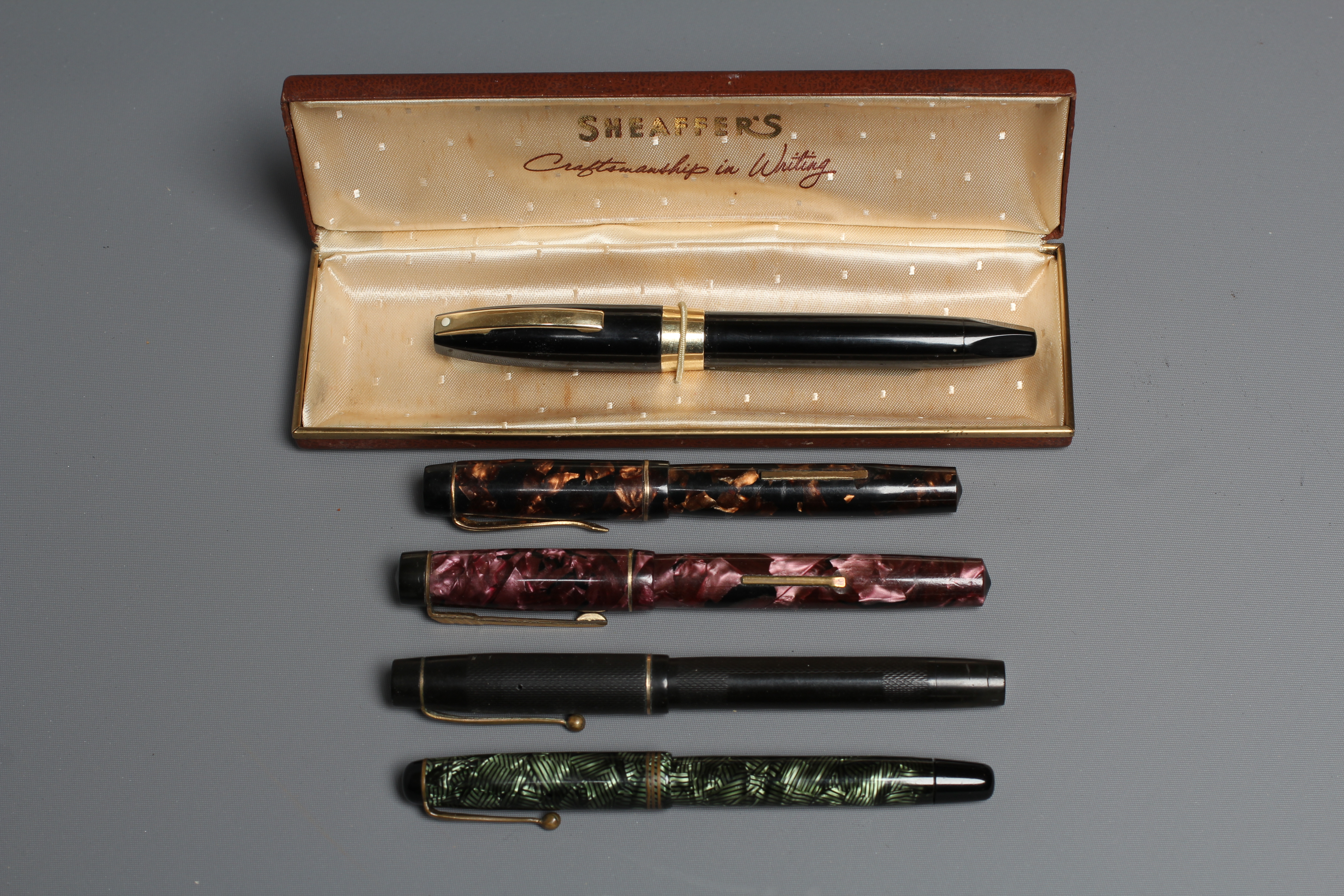 FIVE FOUNTAIN PENS: comprising a black Sheaffer pen marked 14k with original box Image