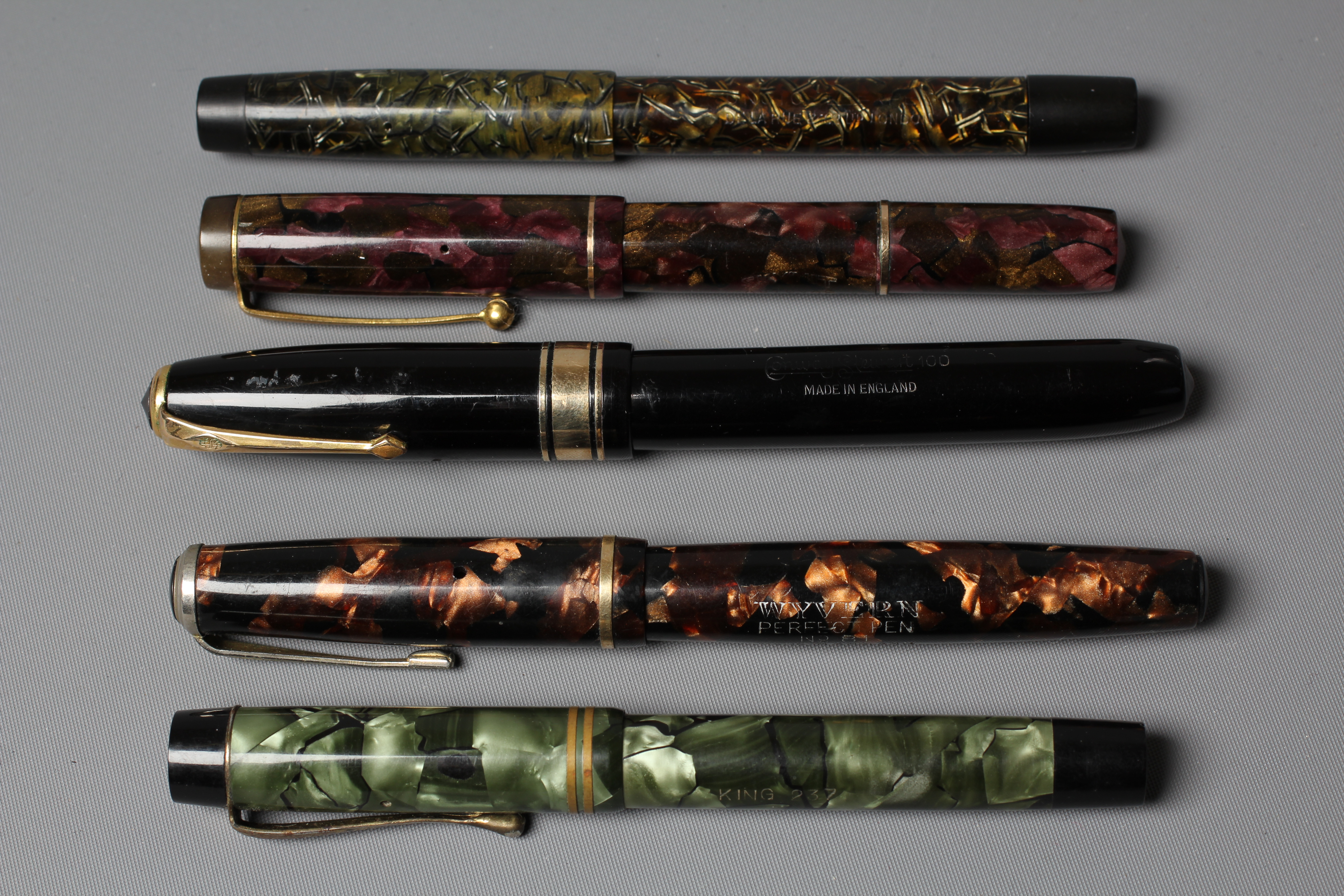 FIVE FOUNTAIN PENS: comprising a black Duro Conway Stewart lever filler pen marked 14ct Image
