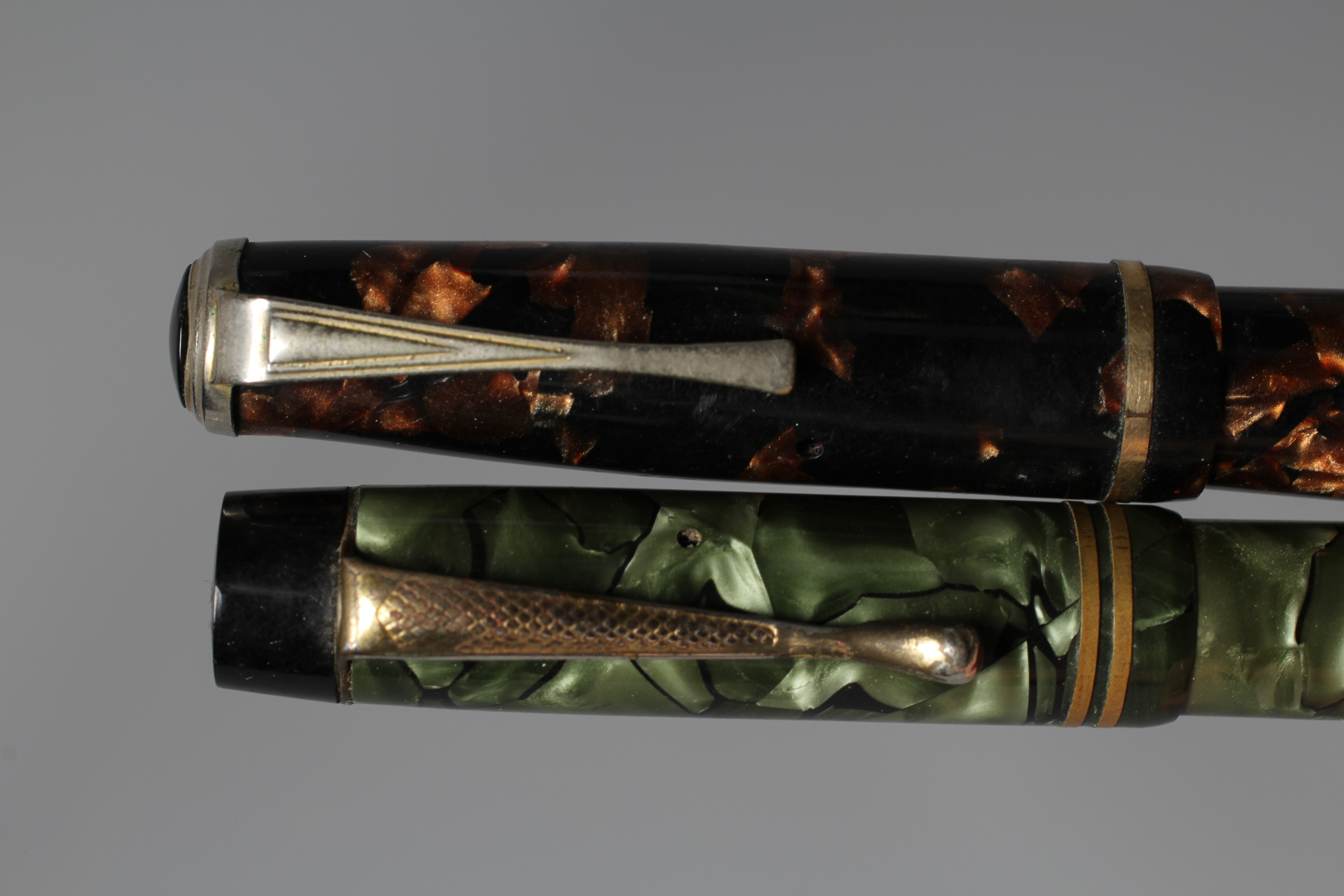 FIVE FOUNTAIN PENS: comprising a black Duro Conway Stewart lever filler pen marked 14ct Image