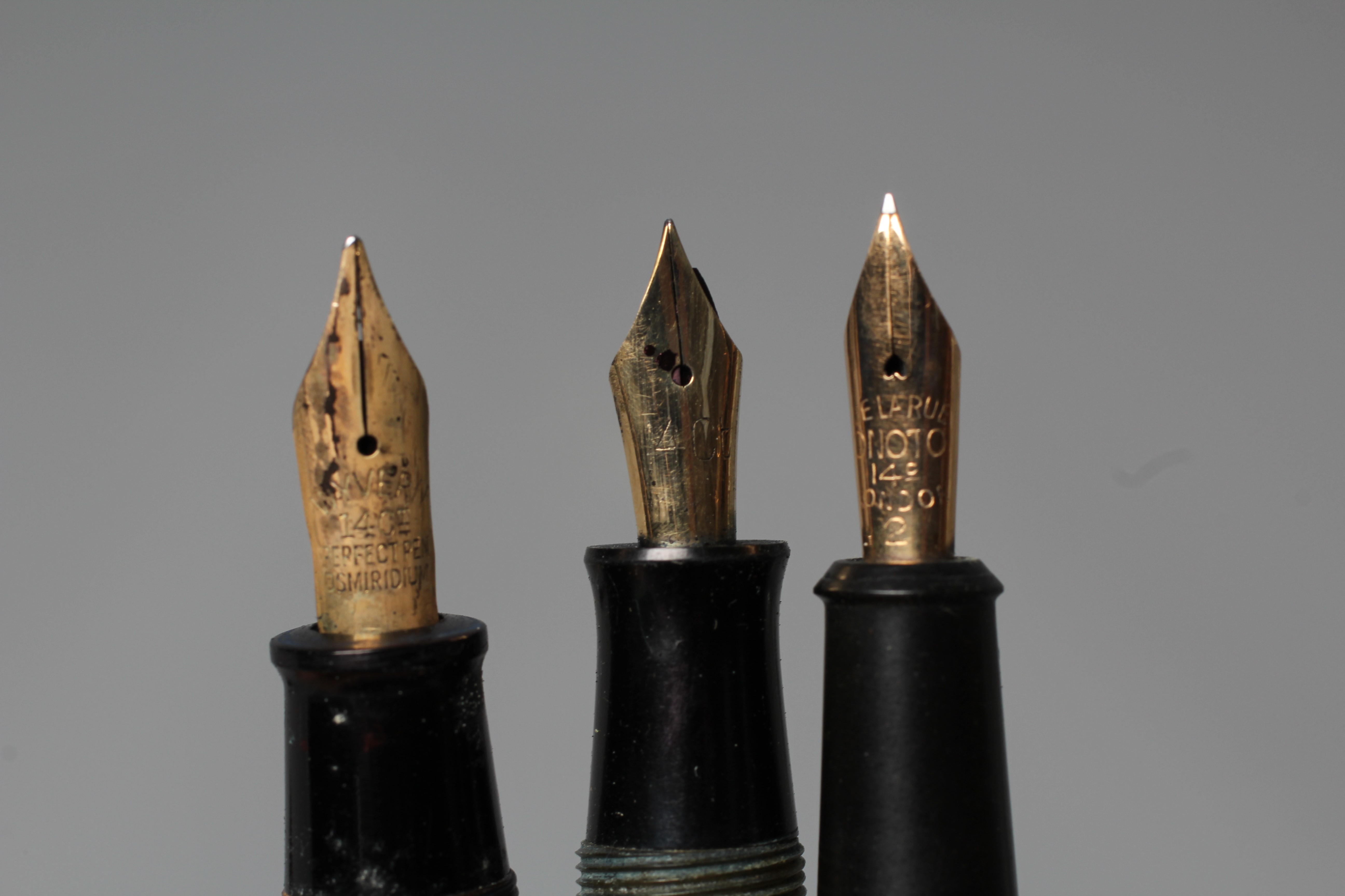 FIVE FOUNTAIN PENS: comprising a black Duro Conway Stewart lever filler pen marked 14ct Image
