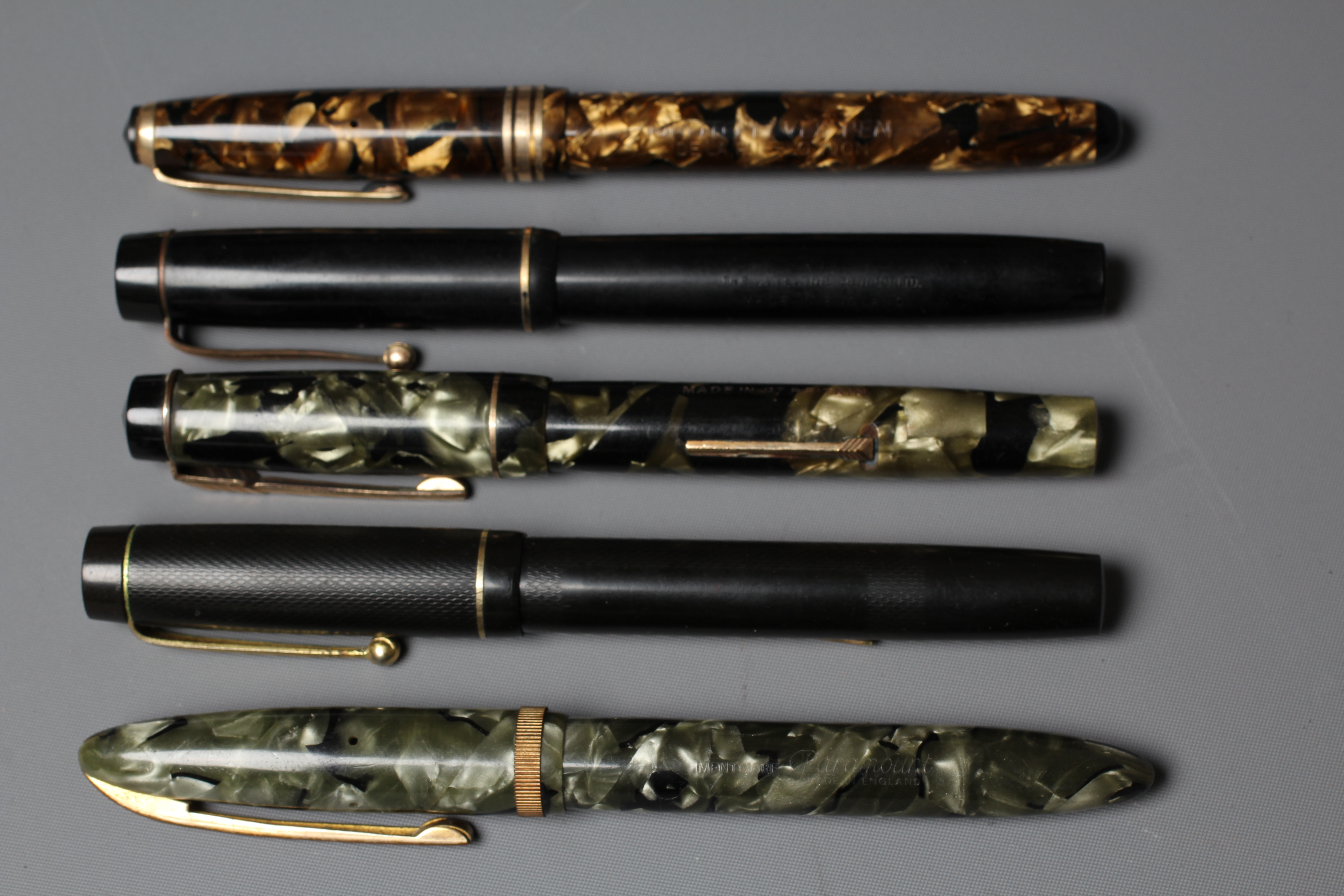 FIVE FOUNTAIN PENS: comprising a black Stephens pen marked 14ct Image