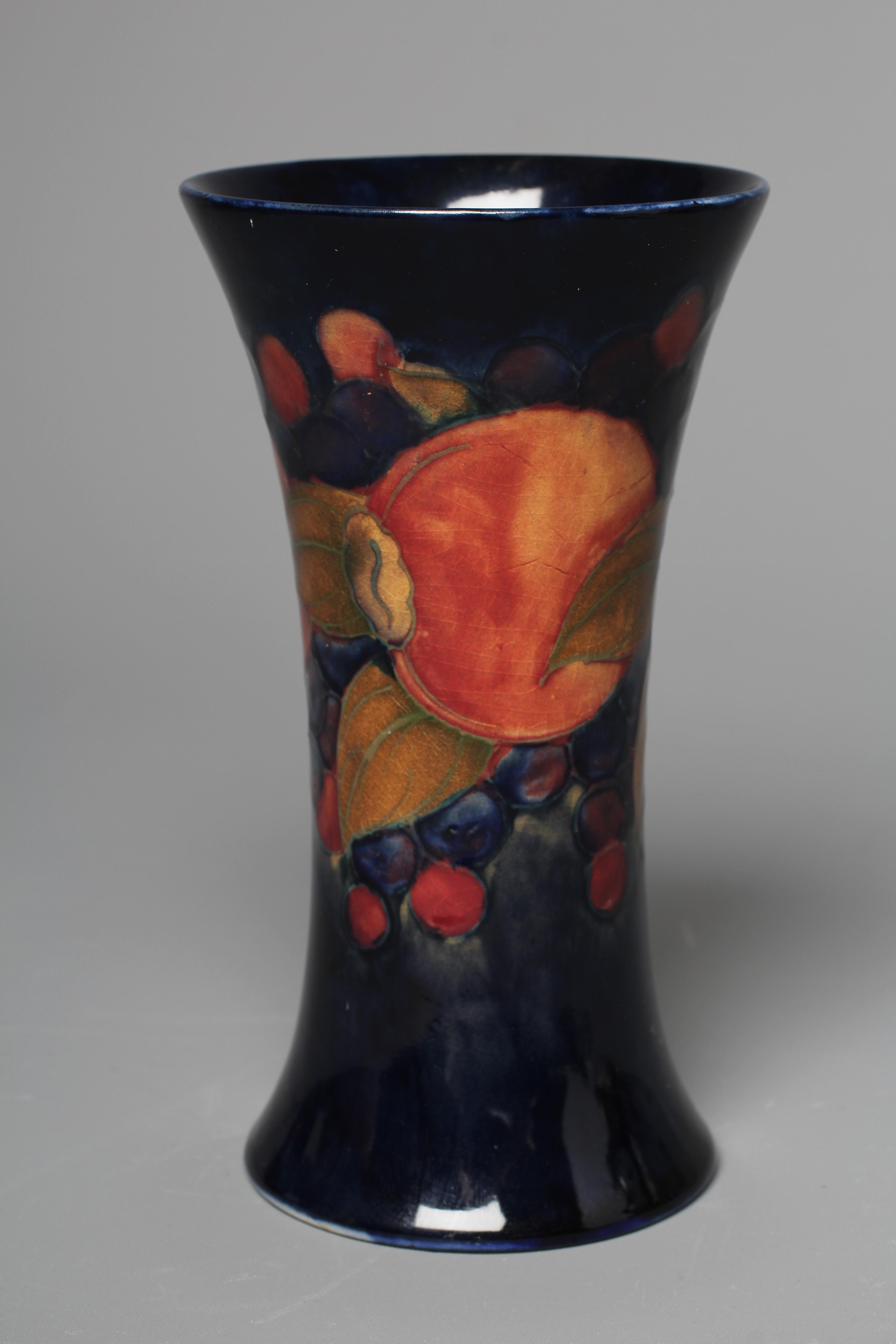 A MOORCROFT POMEGRANATE VASE, mid 20th century, of waisted cylindrical form, signed in green, Image
