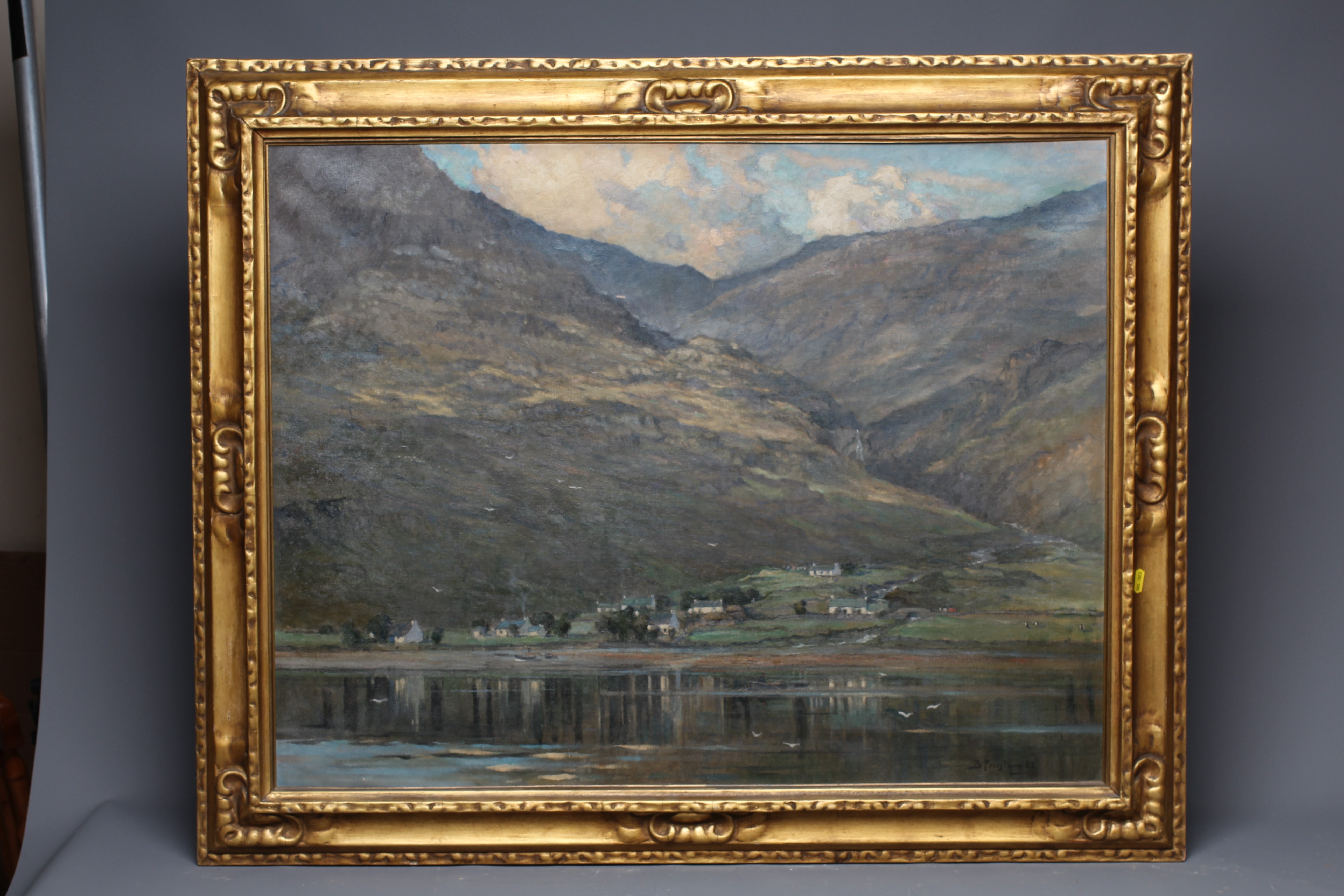 BERTRAM WALTER PRIESTMAN (1868-1951) View of a Scottish Village beside a Loch, signed and dated '23 Image