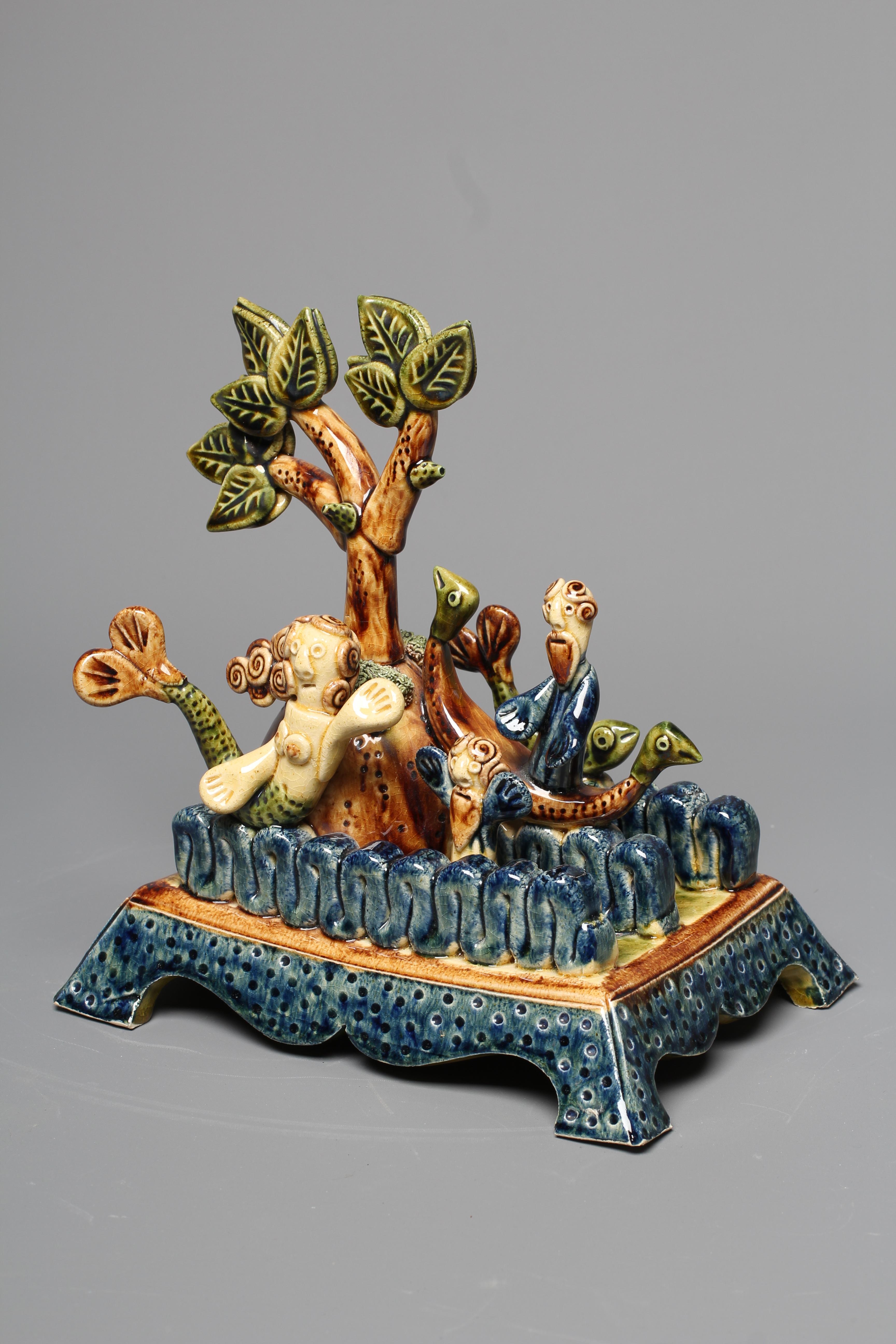 PAUL YOUNG (B.1961) A SLIPWARE MERMAID FIGURE GROUP modelled as a mermaid balancing on waves Image