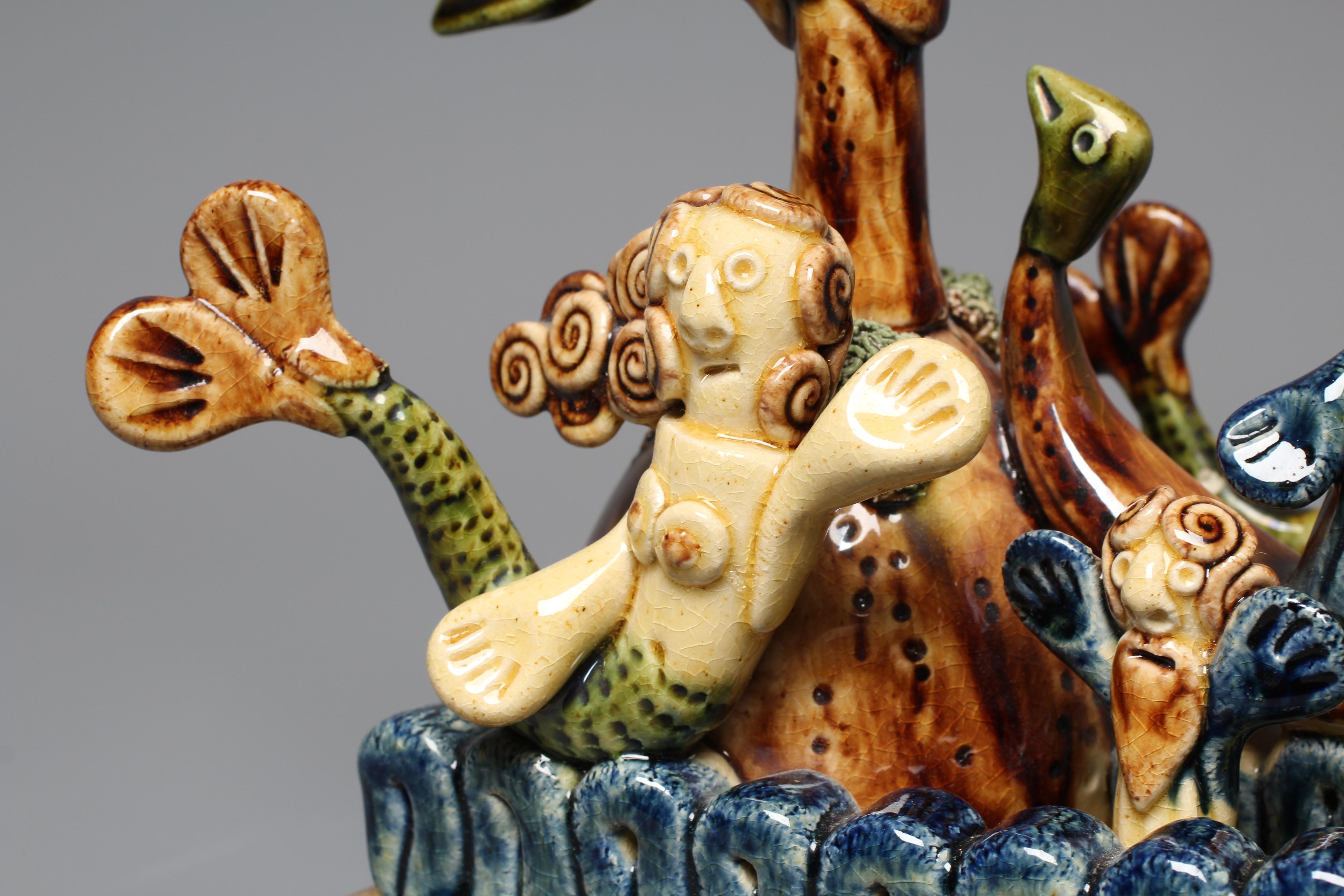 PAUL YOUNG (B.1961) A SLIPWARE MERMAID FIGURE GROUP modelled as a mermaid balancing on waves Image