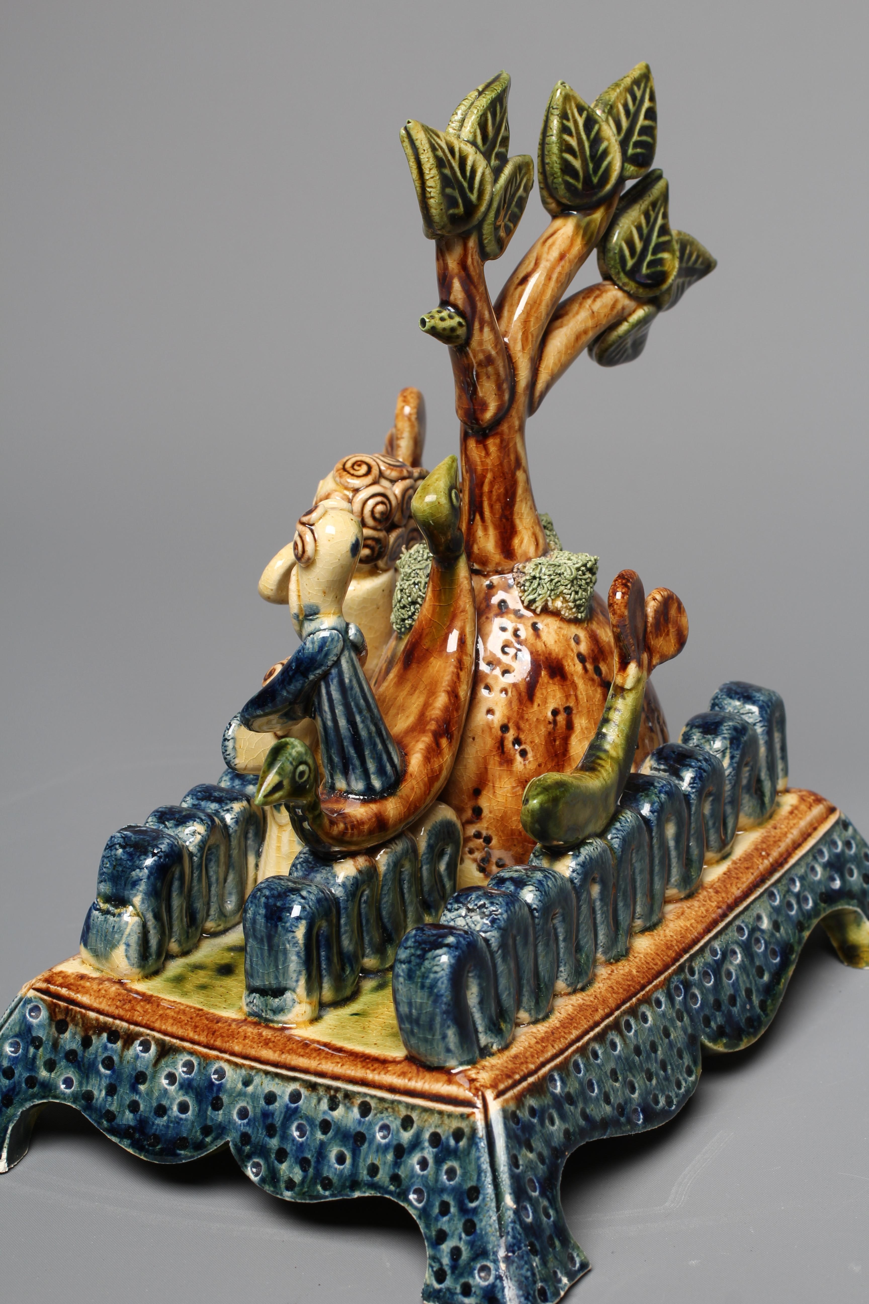 PAUL YOUNG (B.1961) A SLIPWARE MERMAID FIGURE GROUP modelled as a mermaid balancing on waves Image