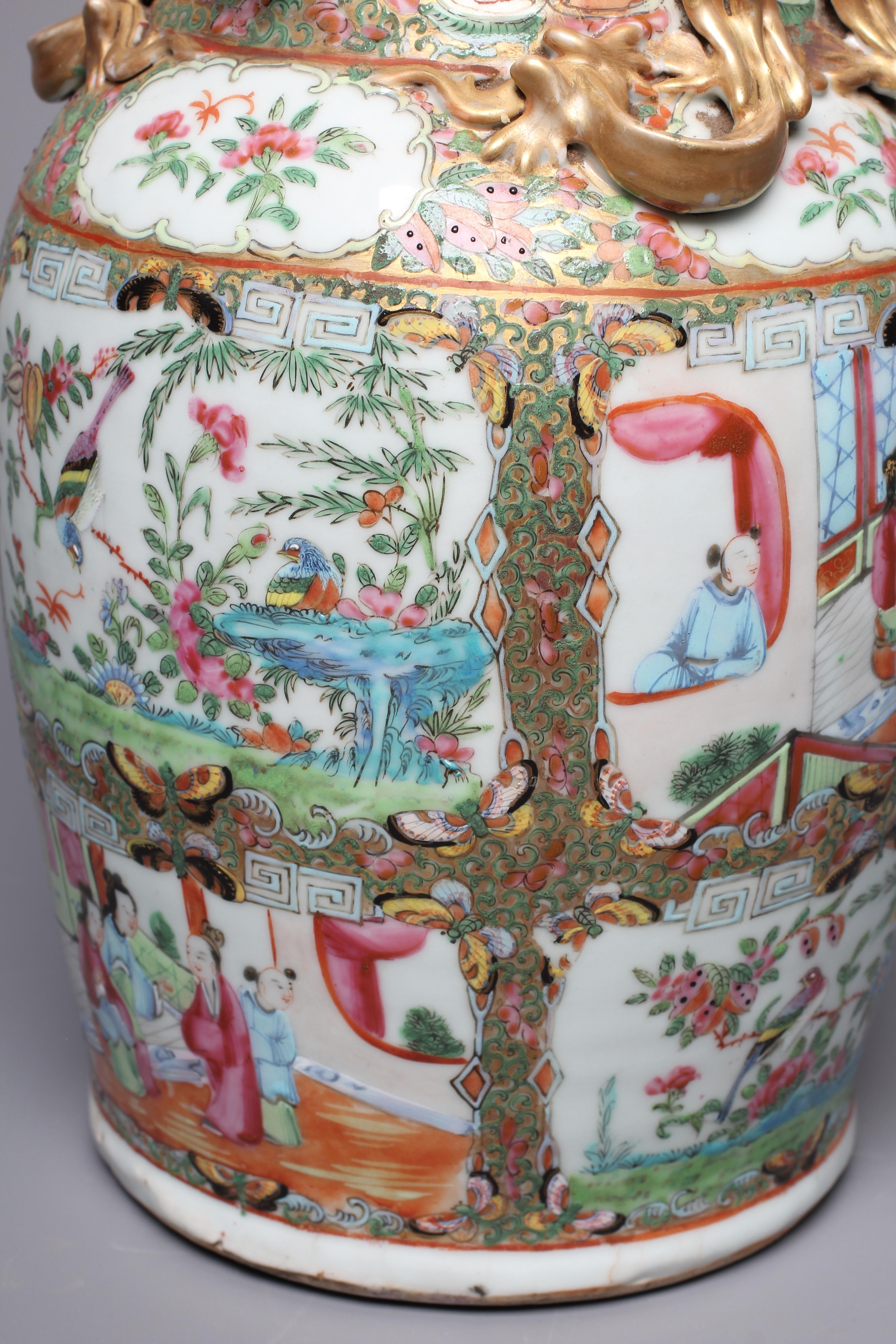 A CANTONESE FAMILLE ROSE PORCELAIN VASE of baluster form with everted rim, chi-long handles and Image