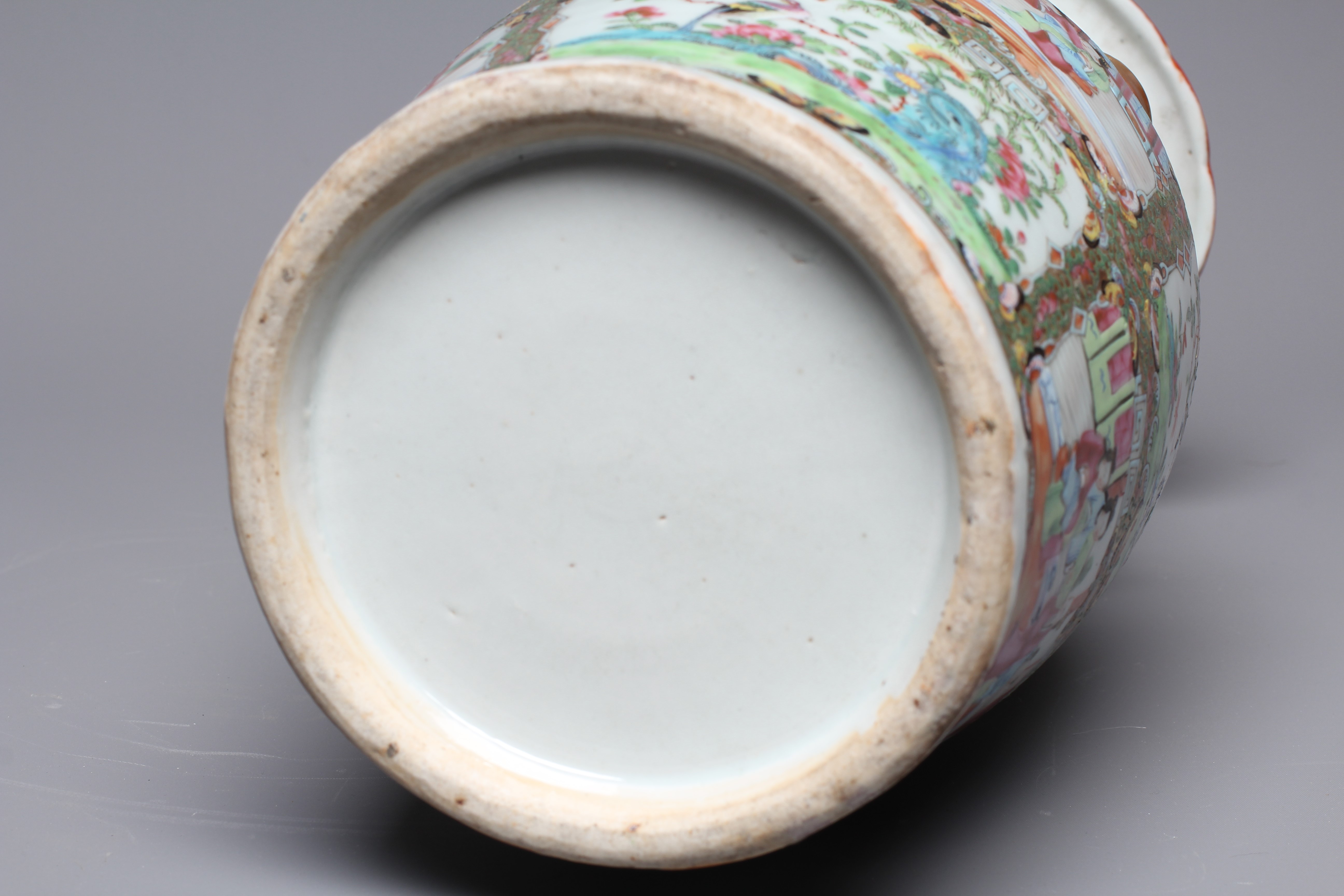 A CANTONESE FAMILLE ROSE PORCELAIN VASE of baluster form with everted rim, chi-long handles and Image