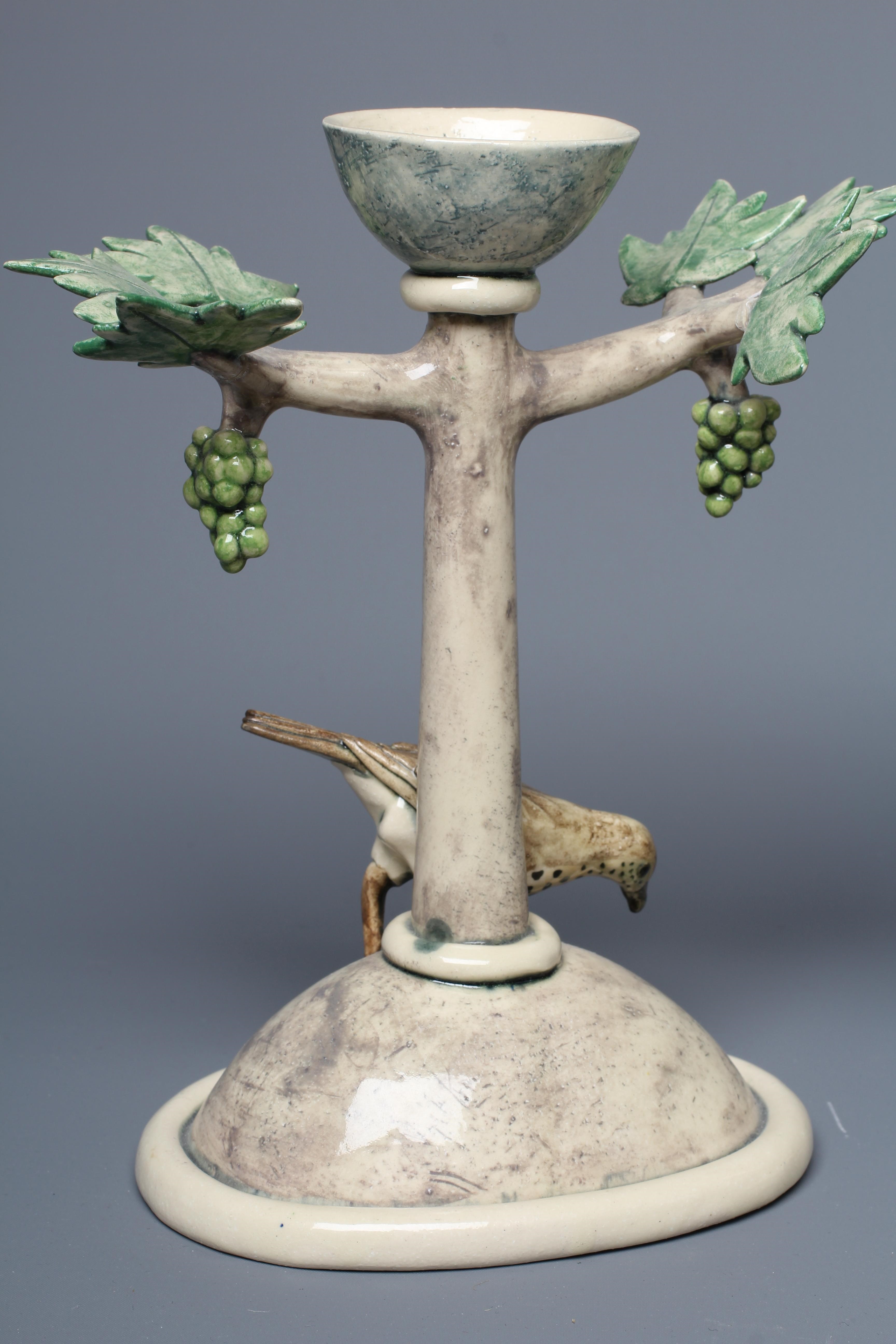 ANNA LAMBERT (B.1957) A PAIR OF SLIPWARE CANDLESTICKS modelled as stylised fruiting vines on high Image