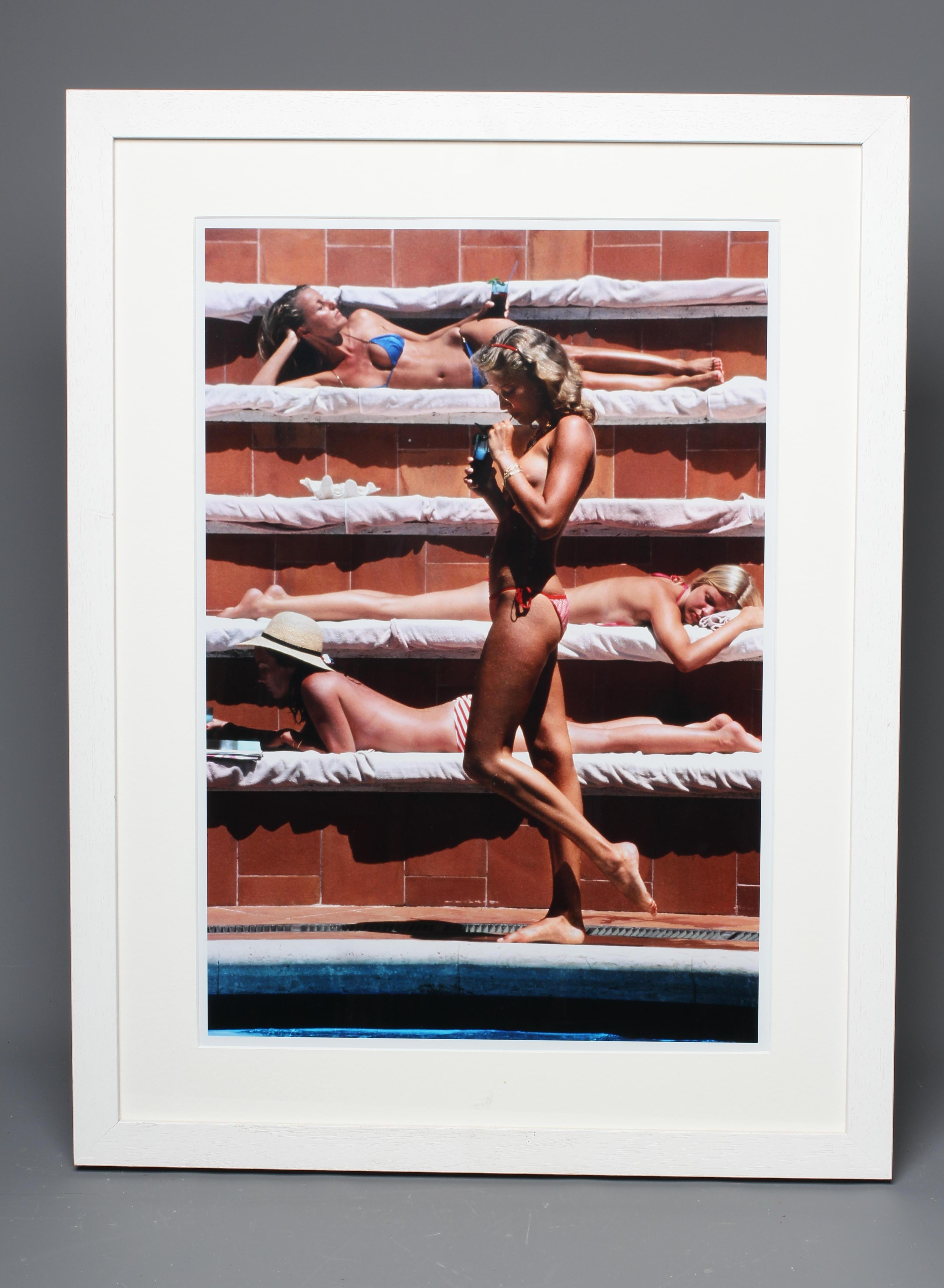 AFTER SLIM AARONS (1916-2006) Beach Scene, digital print, 23 1/2" x 16 1/2", framed and glazed Image