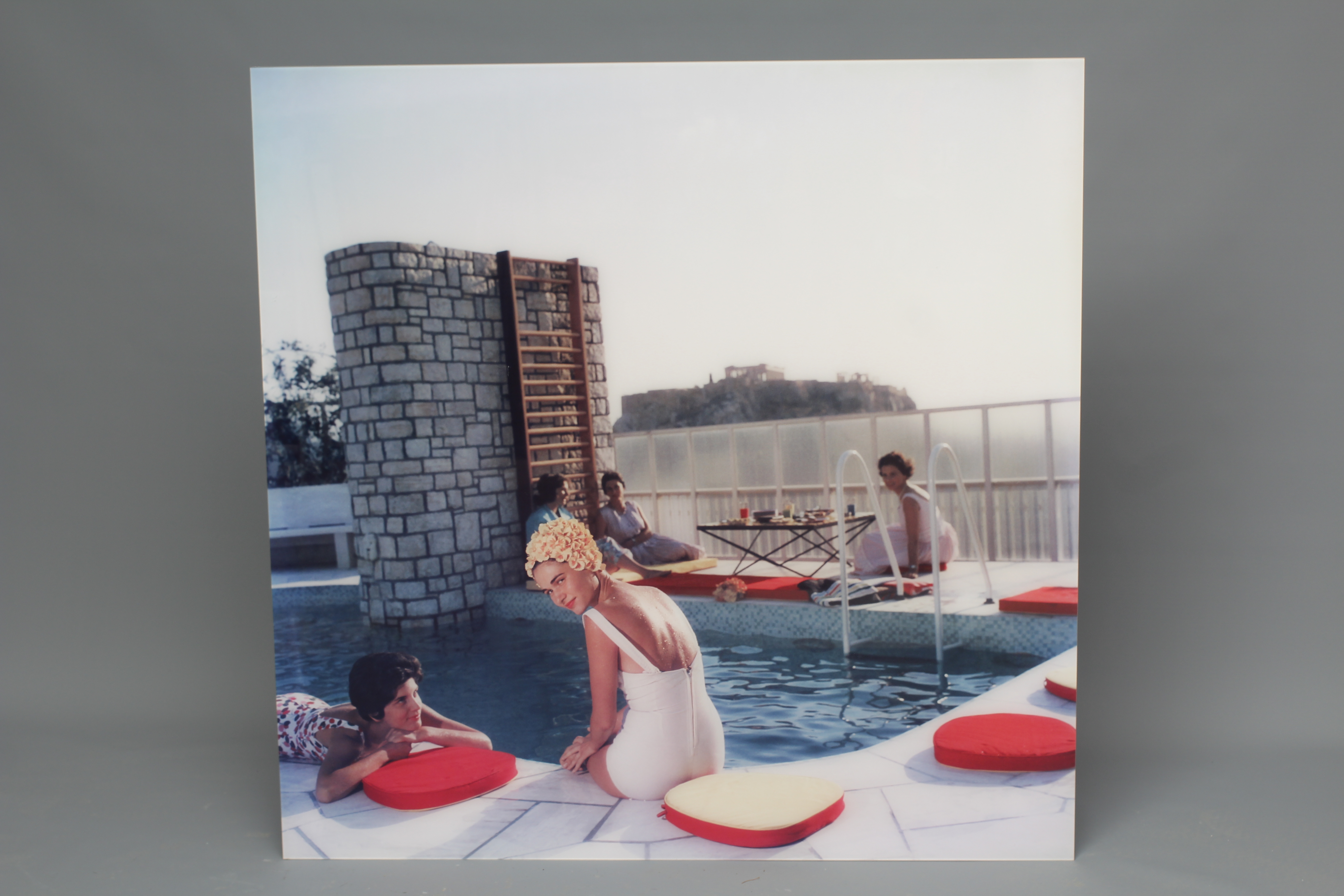 AFTER SLIM AARONS (1916-2000) Penthouse Pool, photograph in colours, YellowKorner certificate of Image