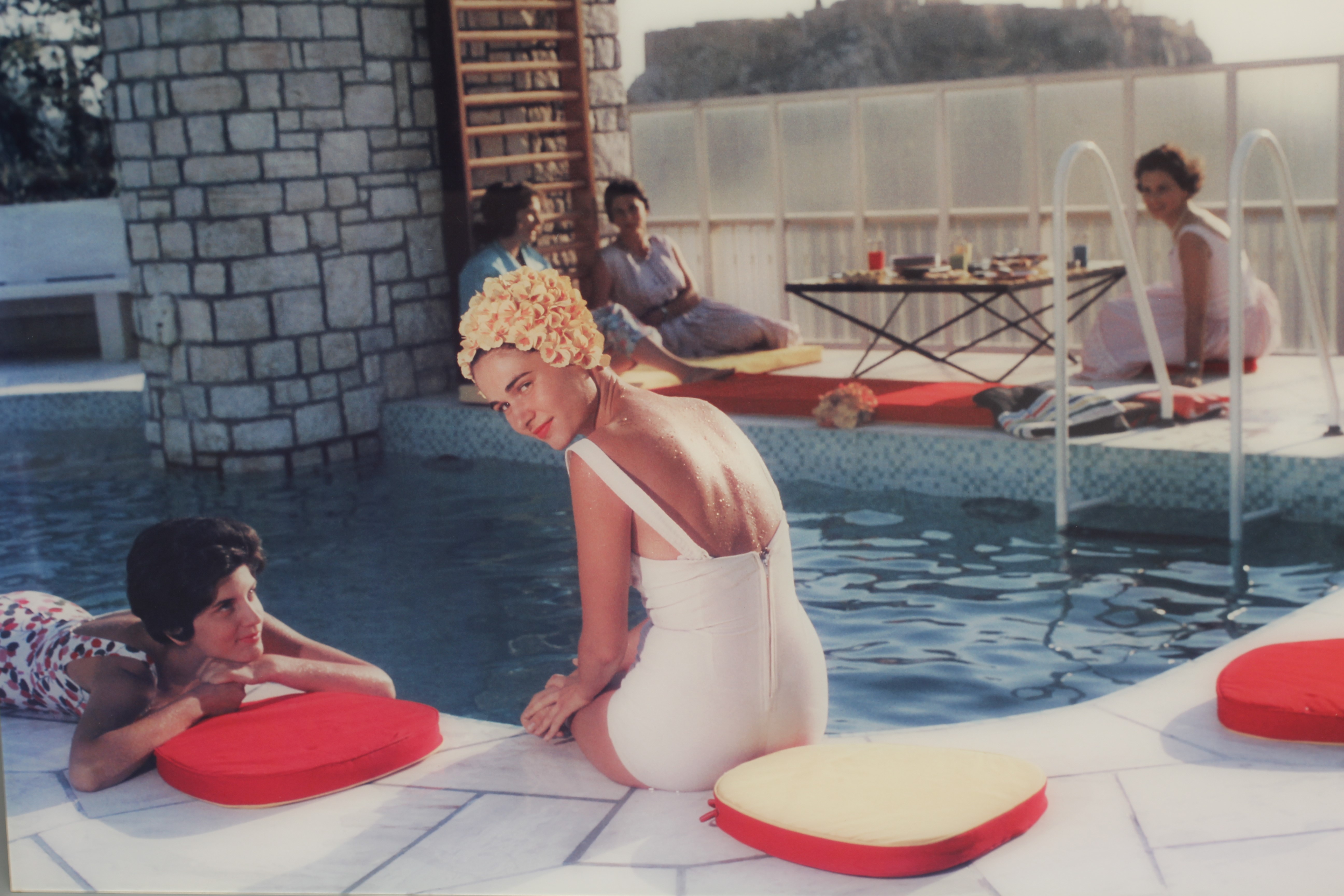 AFTER SLIM AARONS (1916-2000) Penthouse Pool, photograph in colours, YellowKorner certificate of Image