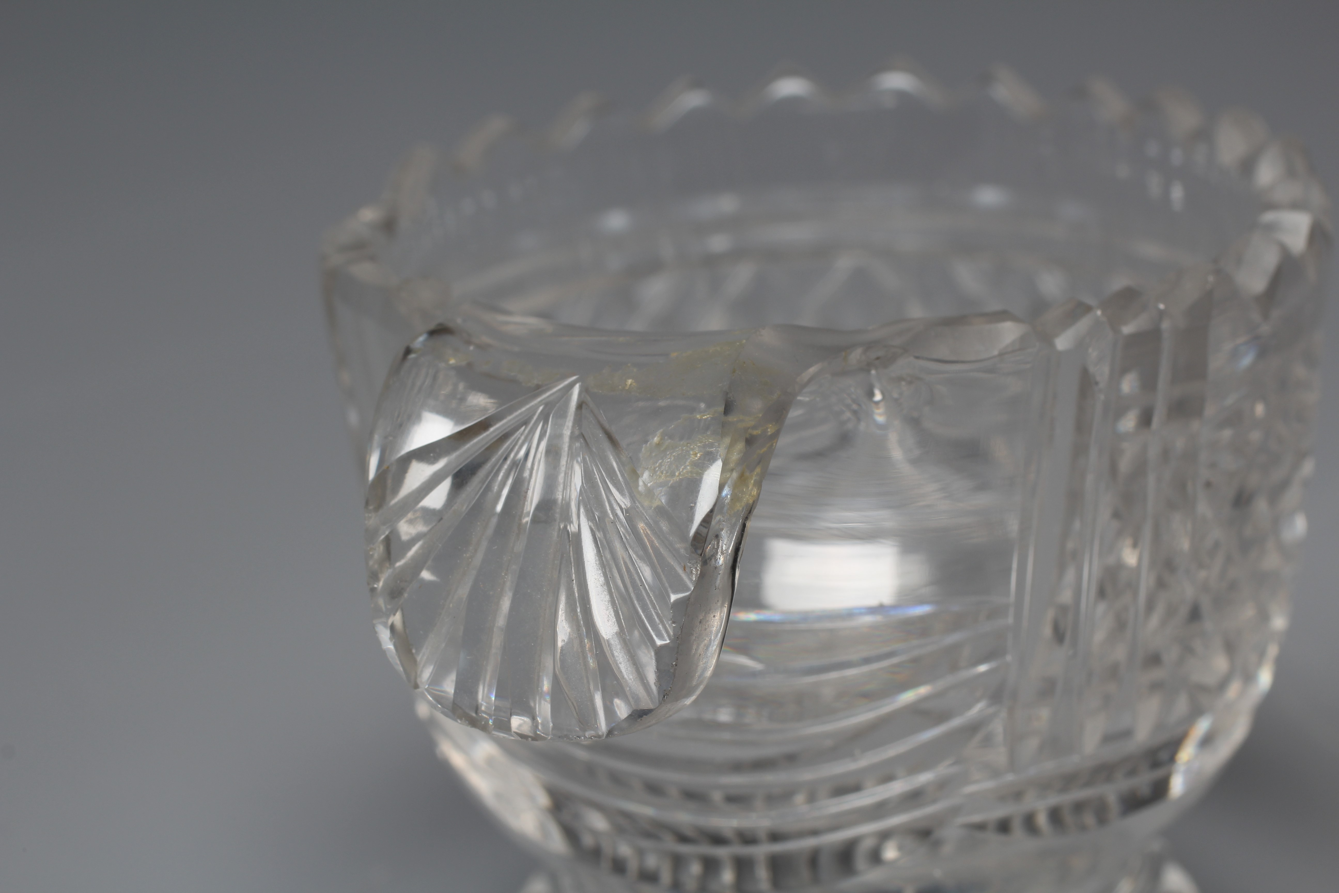 A PAIR OF IRISH GLASS PIGGINS, early 19th century, the plain U bowls with dentil cut rims and Image