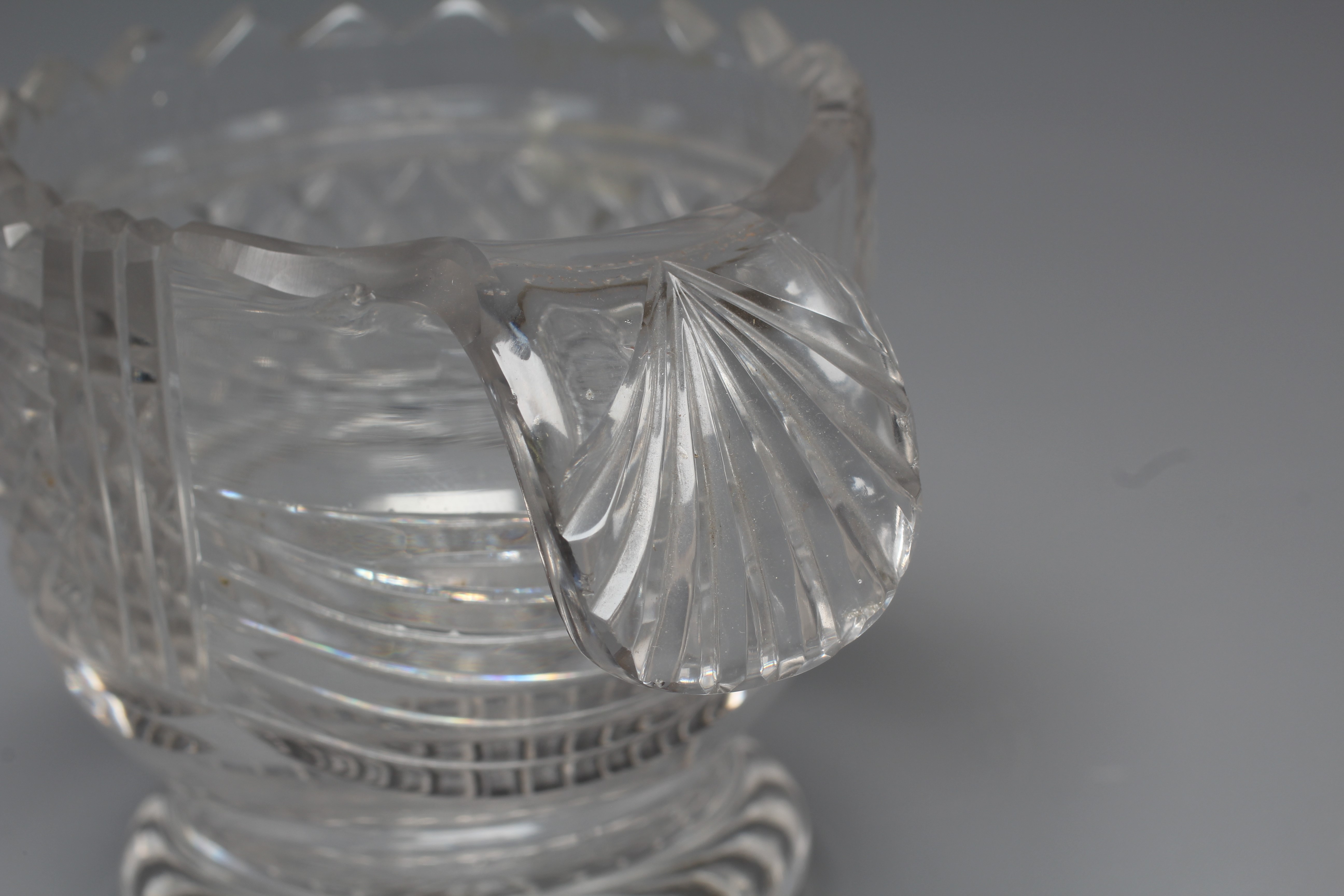 A PAIR OF IRISH GLASS PIGGINS, early 19th century, the plain U bowls with dentil cut rims and Image