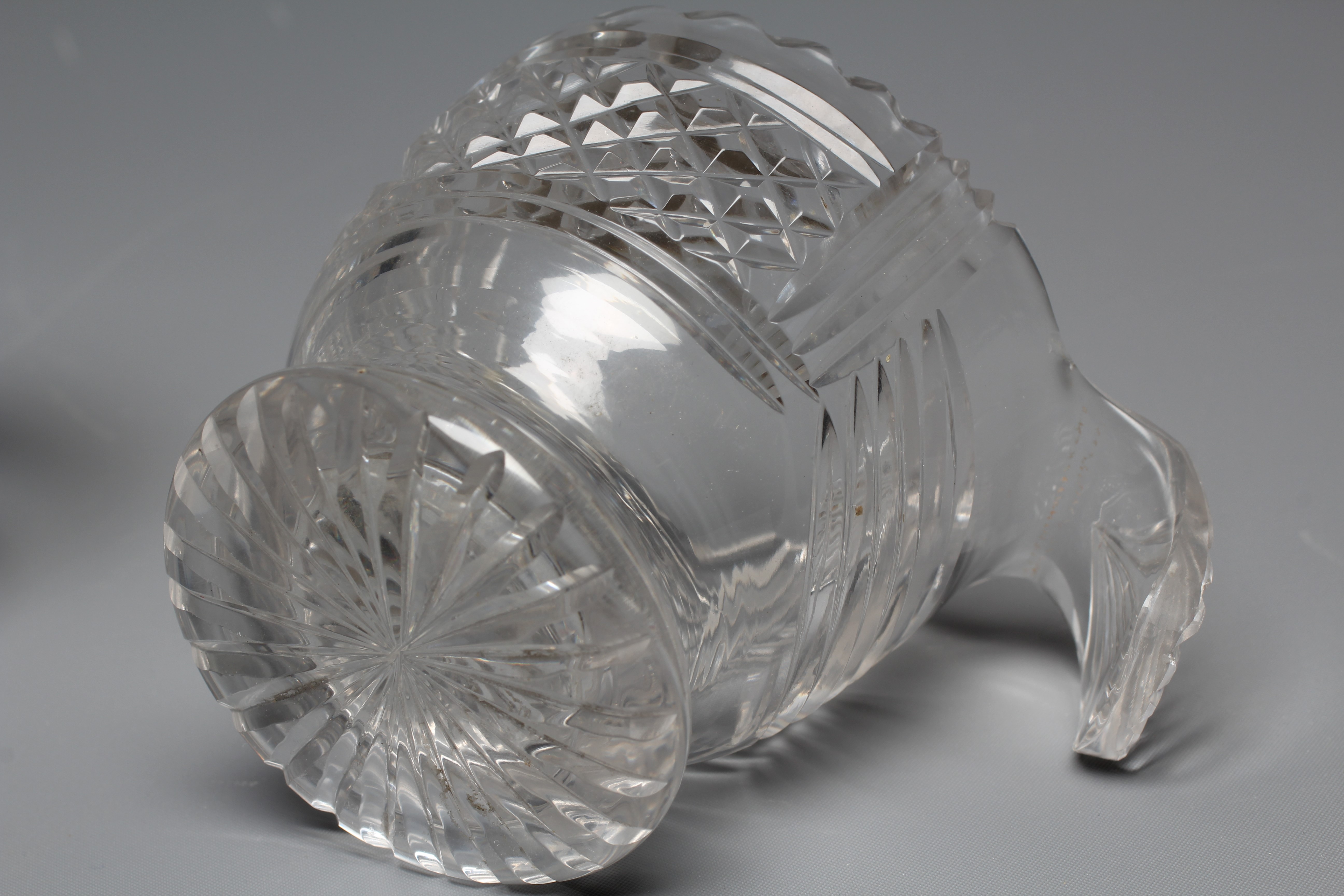 A PAIR OF IRISH GLASS PIGGINS, early 19th century, the plain U bowls with dentil cut rims and Image