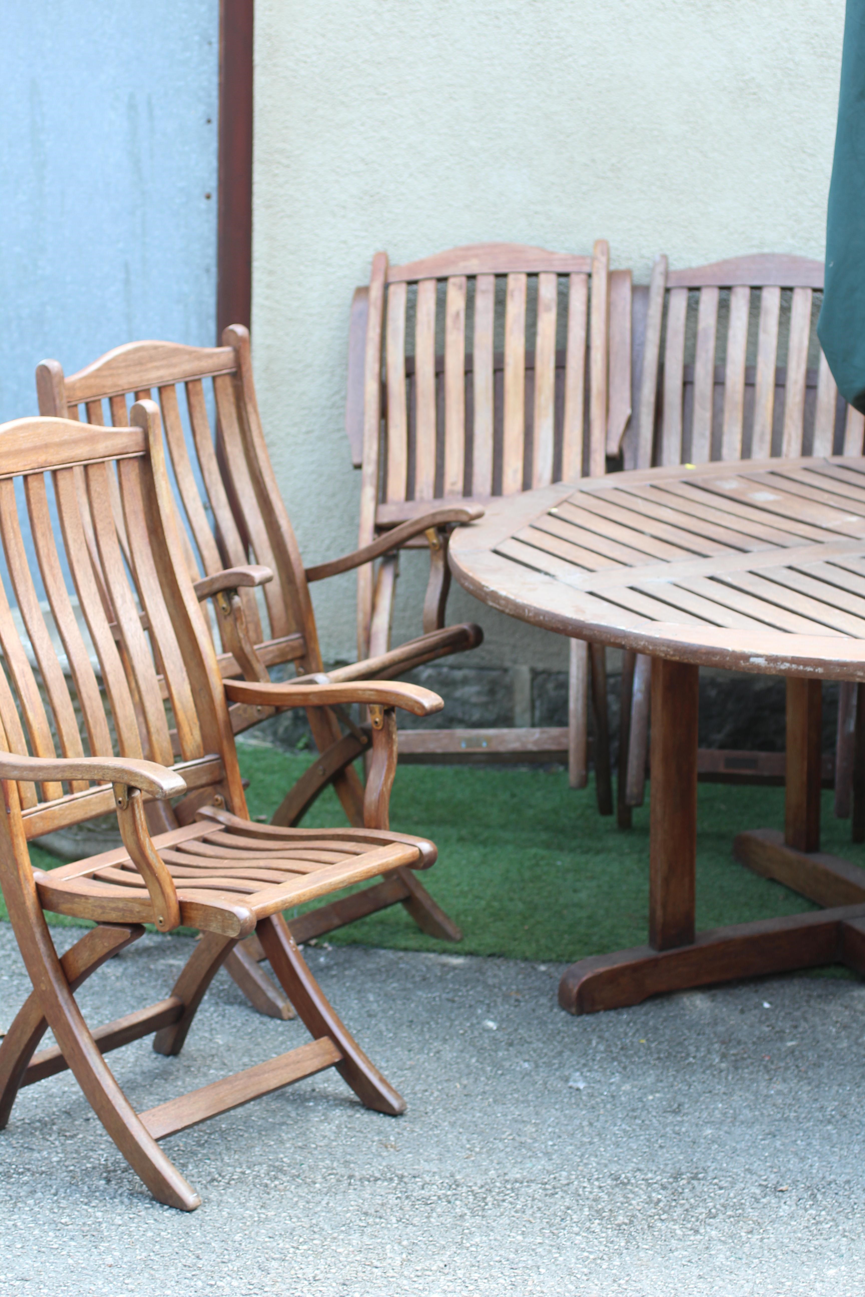 A SLATTED TEAK DINING SUITE, comprising circular table on cruciform square section support, 59 1/2" Image