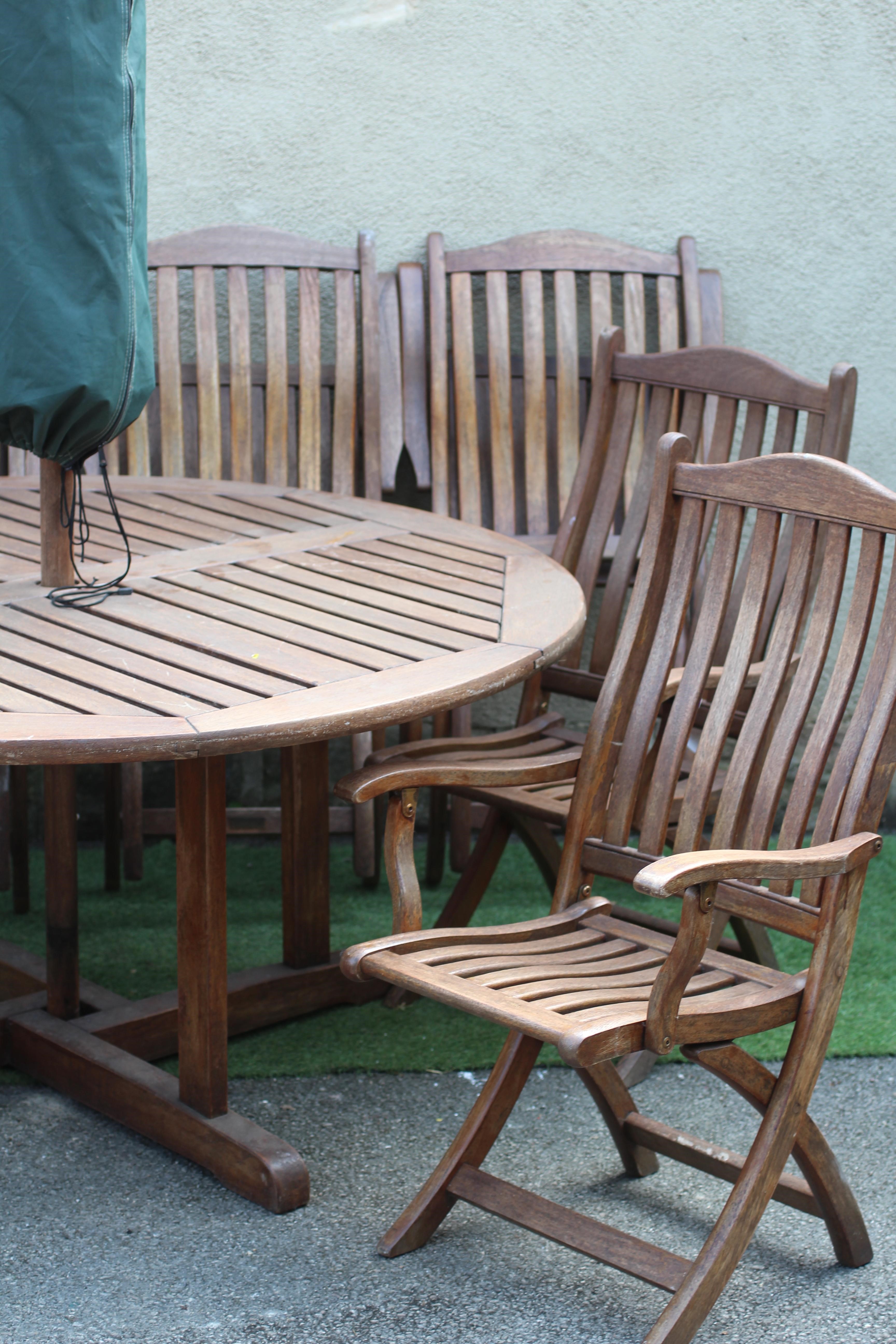 A SLATTED TEAK DINING SUITE, comprising circular table on cruciform square section support, 59 1/2" Image