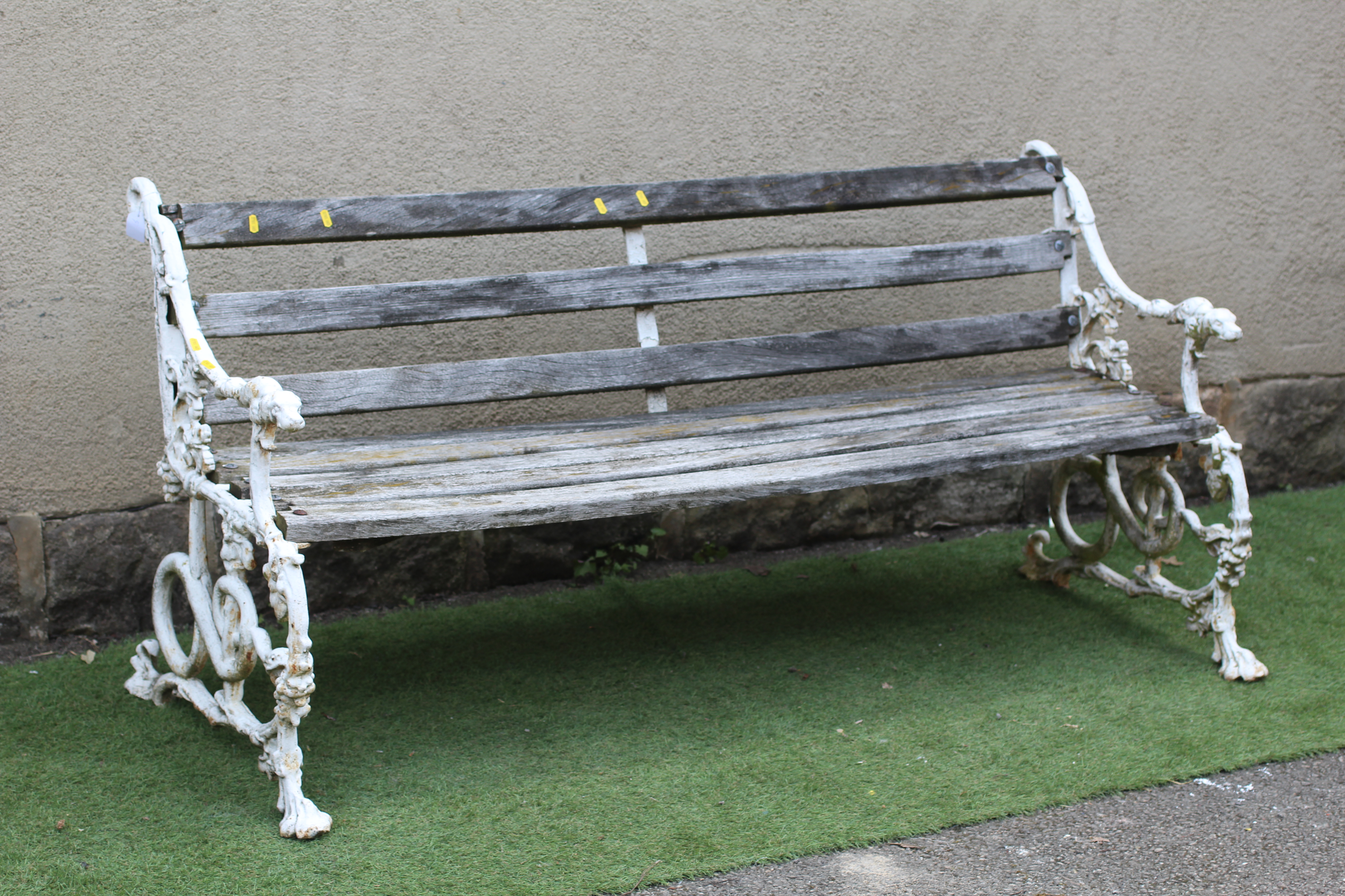 A VICTORIAN CAST IRON BENCH in "Grape and Serpent" pattern with slatted wood seat, 64 1/2" w x 14" d Image