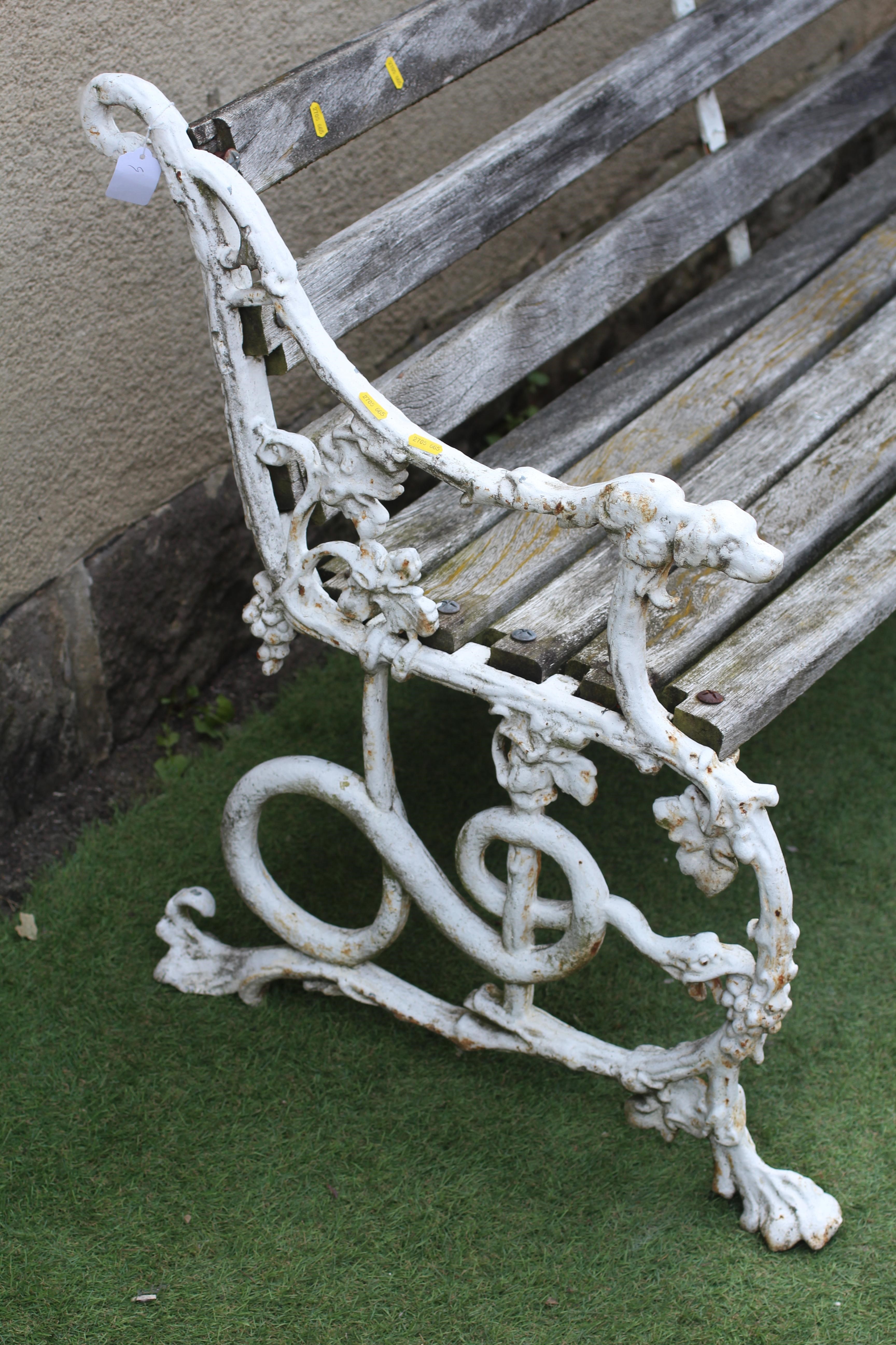 A VICTORIAN CAST IRON BENCH in "Grape and Serpent" pattern with slatted wood seat, 64 1/2" w x 14" d Image