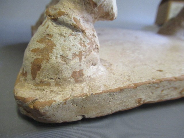 A CHINESE TANG DYNASTY TERRACOTTA HORSE with deep carved mane groove and hole for tail Image