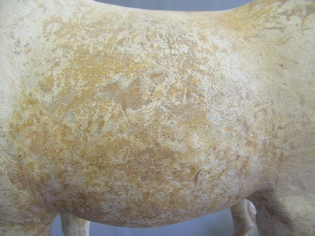 A CHINESE TANG DYNASTY TERRACOTTA HORSE with deep carved mane groove and hole for tail Image