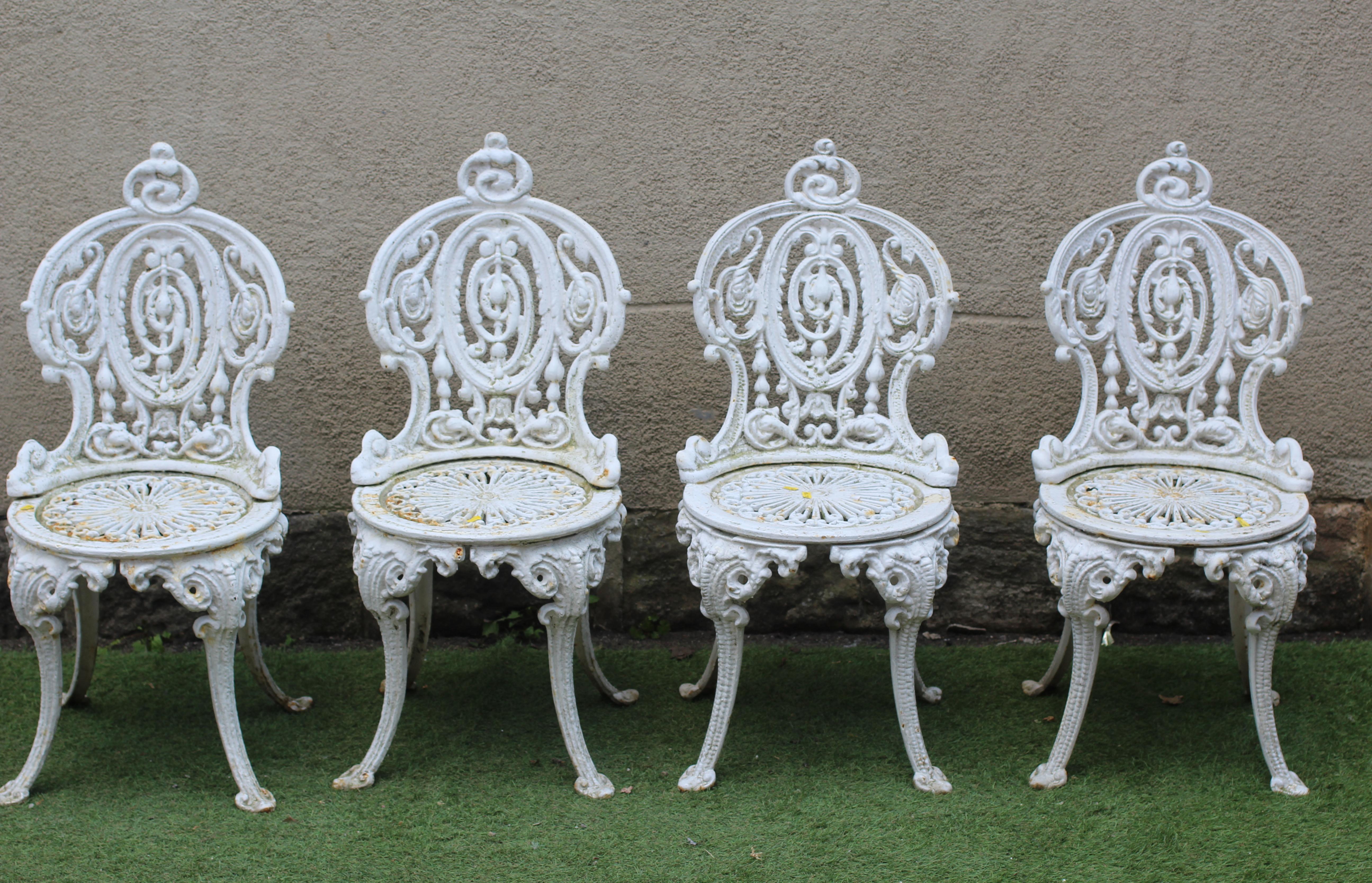 A SET OF FOUR VICTORIAN CAST IRON CHAIRS in the Coalbrookdale rococo revival style, the waisted Image