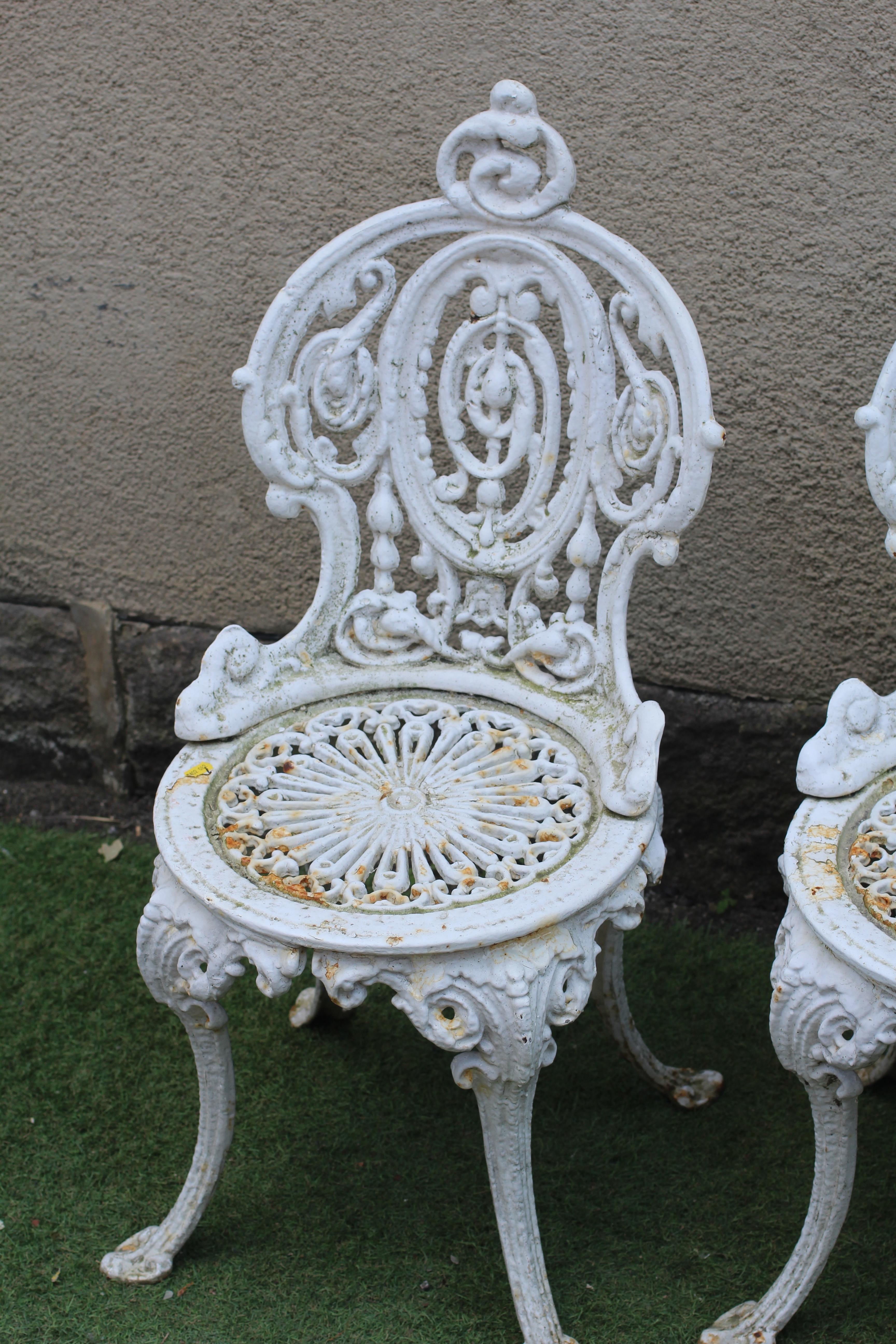 A SET OF FOUR VICTORIAN CAST IRON CHAIRS in the Coalbrookdale rococo revival style, the waisted Image